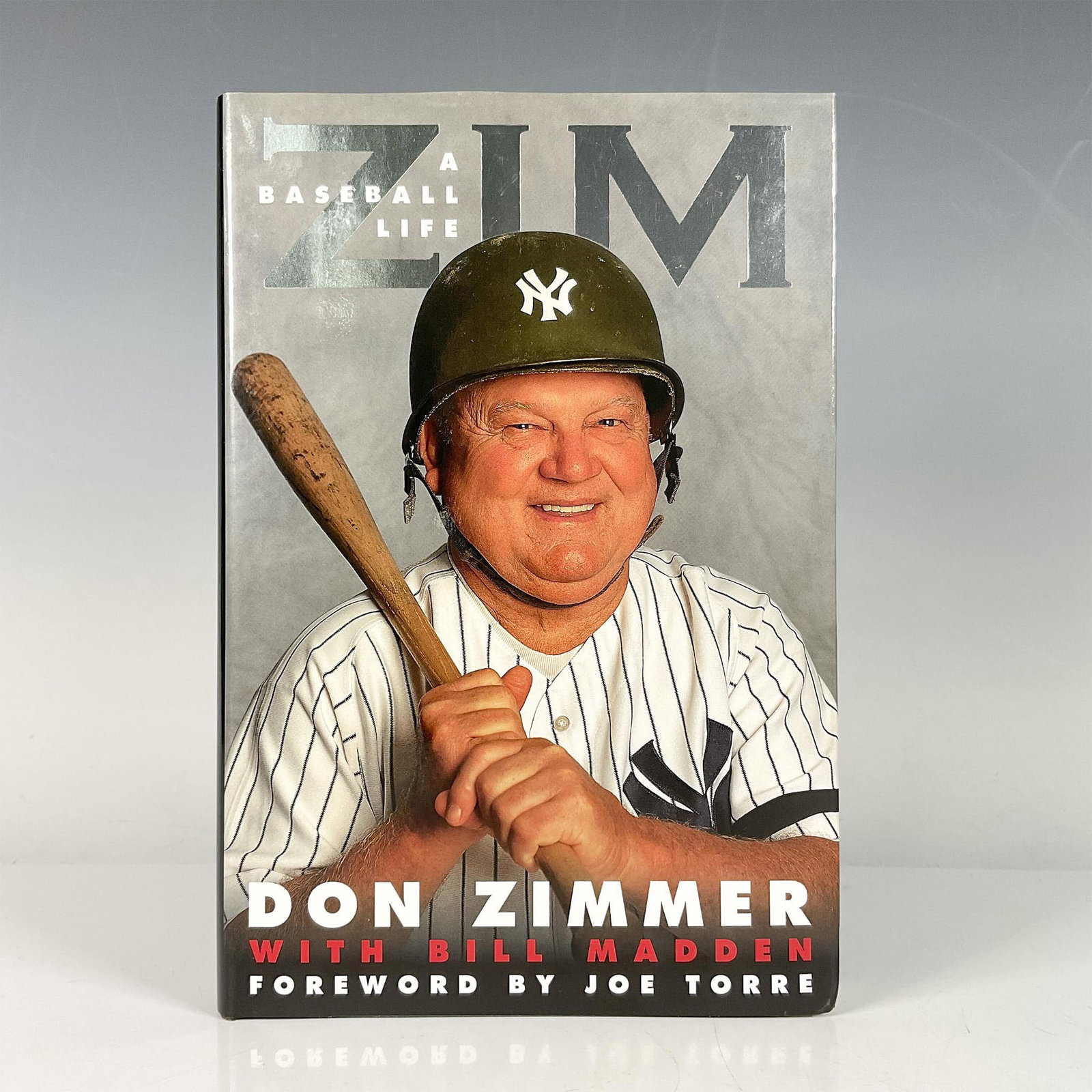 First Edition Signed Don Zimmer Books, Zim: A Baseball Life: Hardcover book with original dustcover and 286 pages. Autographed by Don Zimmer, who was an American MLB infielder, coach, and manager. Also autographed by award winning columnist Bill Madden. ISBN: 9