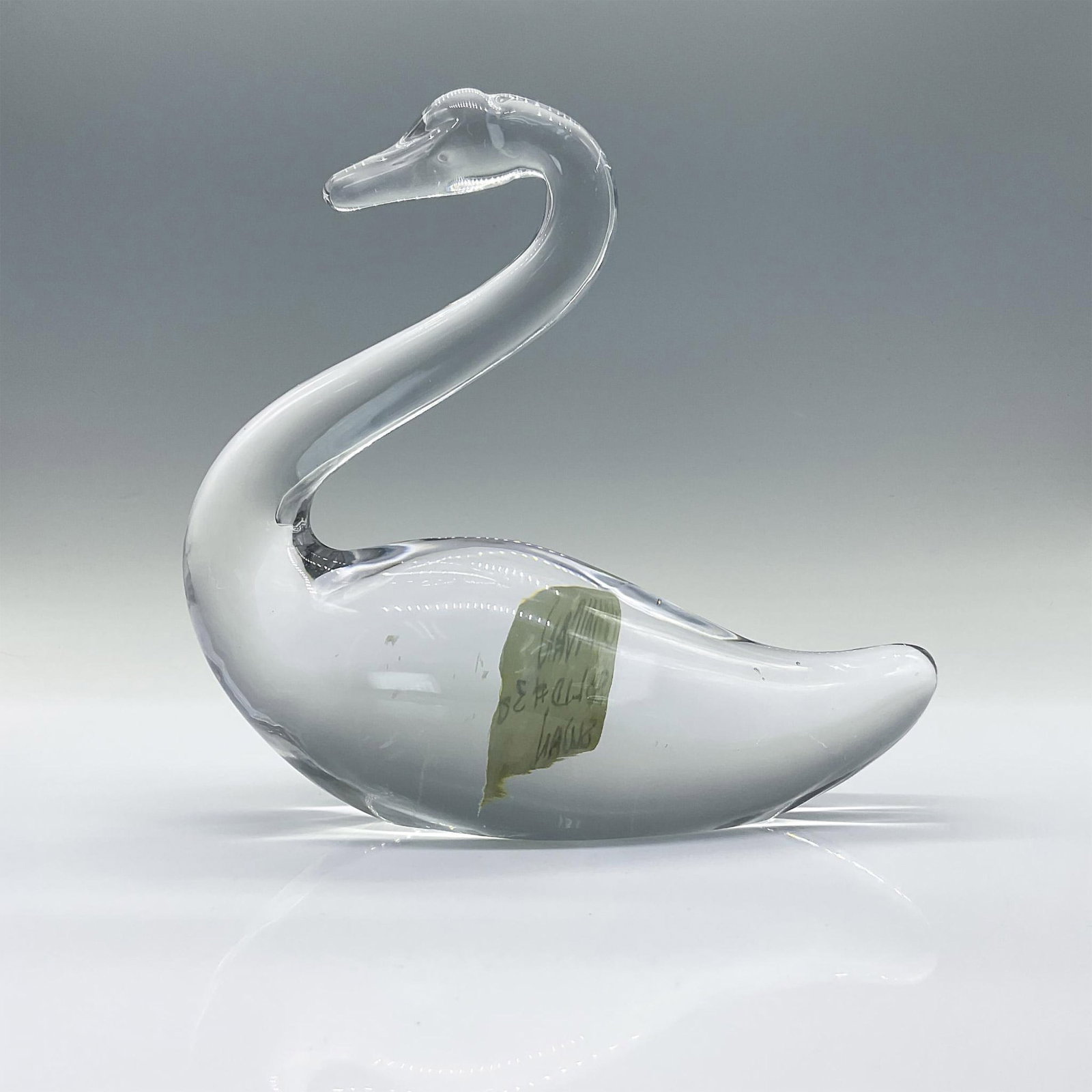 Vintage Duncan Glass Swan Solid Figurine, Colorless: This is an elegant swan crafted and molded from colorless glass. Issued: 20th century Dimensions: 7.25"L x 3"W x 7"H