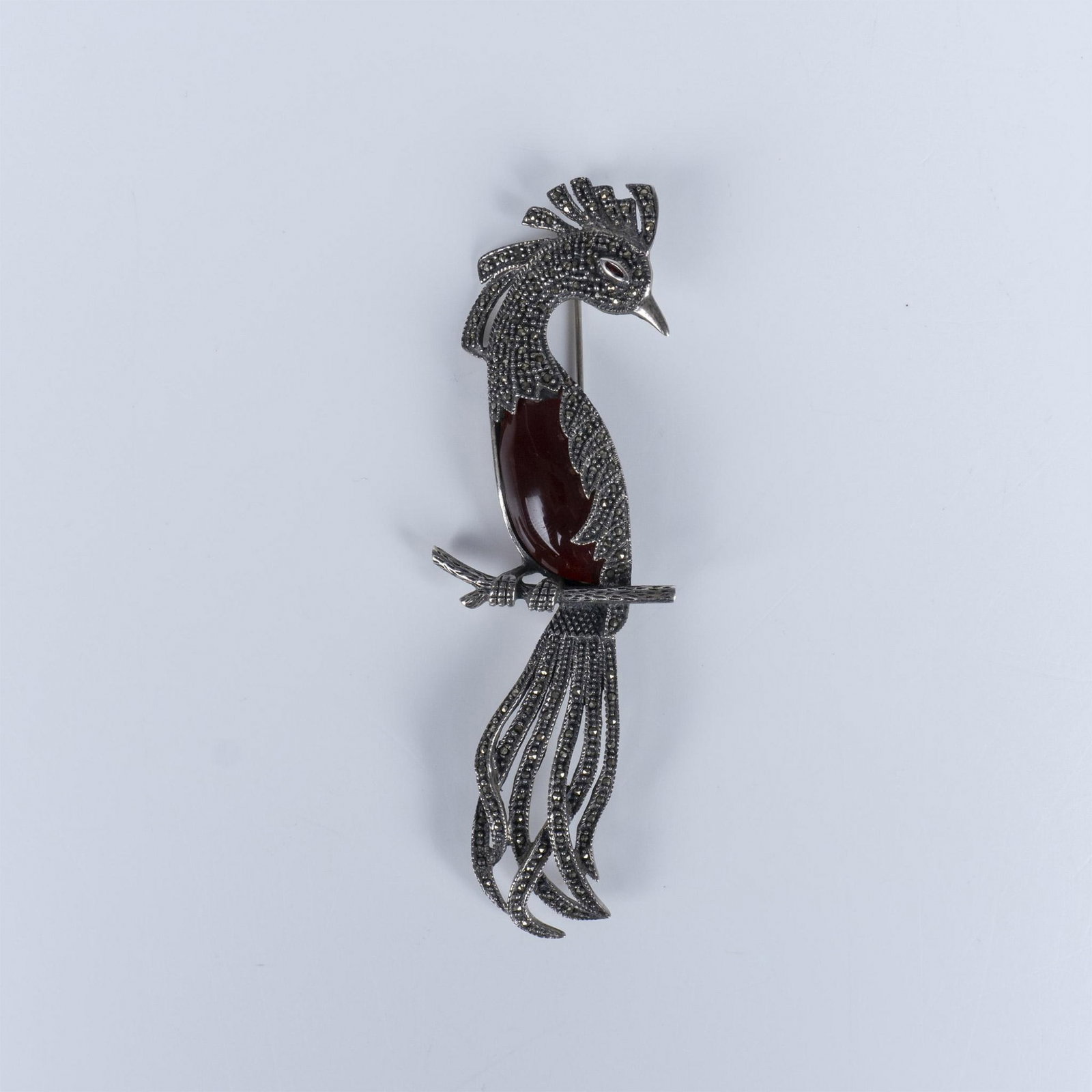 Bird Of Paradise Sterling, Carnelian, and Marcasite Brooch: Gorgeous large sterling silver brooch with carnelian and marcasite stones. Marked 925 on the back. 28g total weight. Dimensions: 4.25"L x 1.5"W