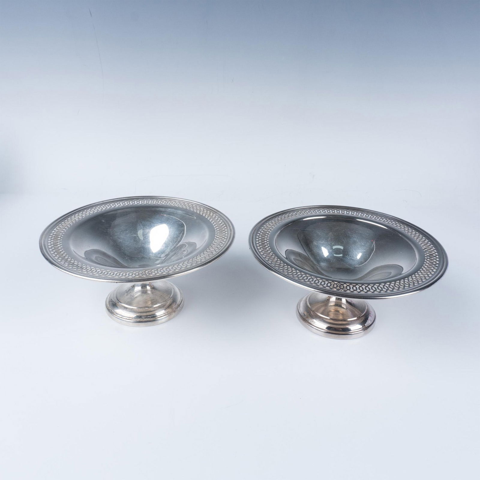 2pc Sheridan Silver Footed Bowl: An elegant pair of Sheridan Silver on Copper footed bowls. Sheridan logo and Sterling On Copper backstamp. Issued: 20th century Dimensions: 6.75"W x 3"H Manufacturer: Sheridan