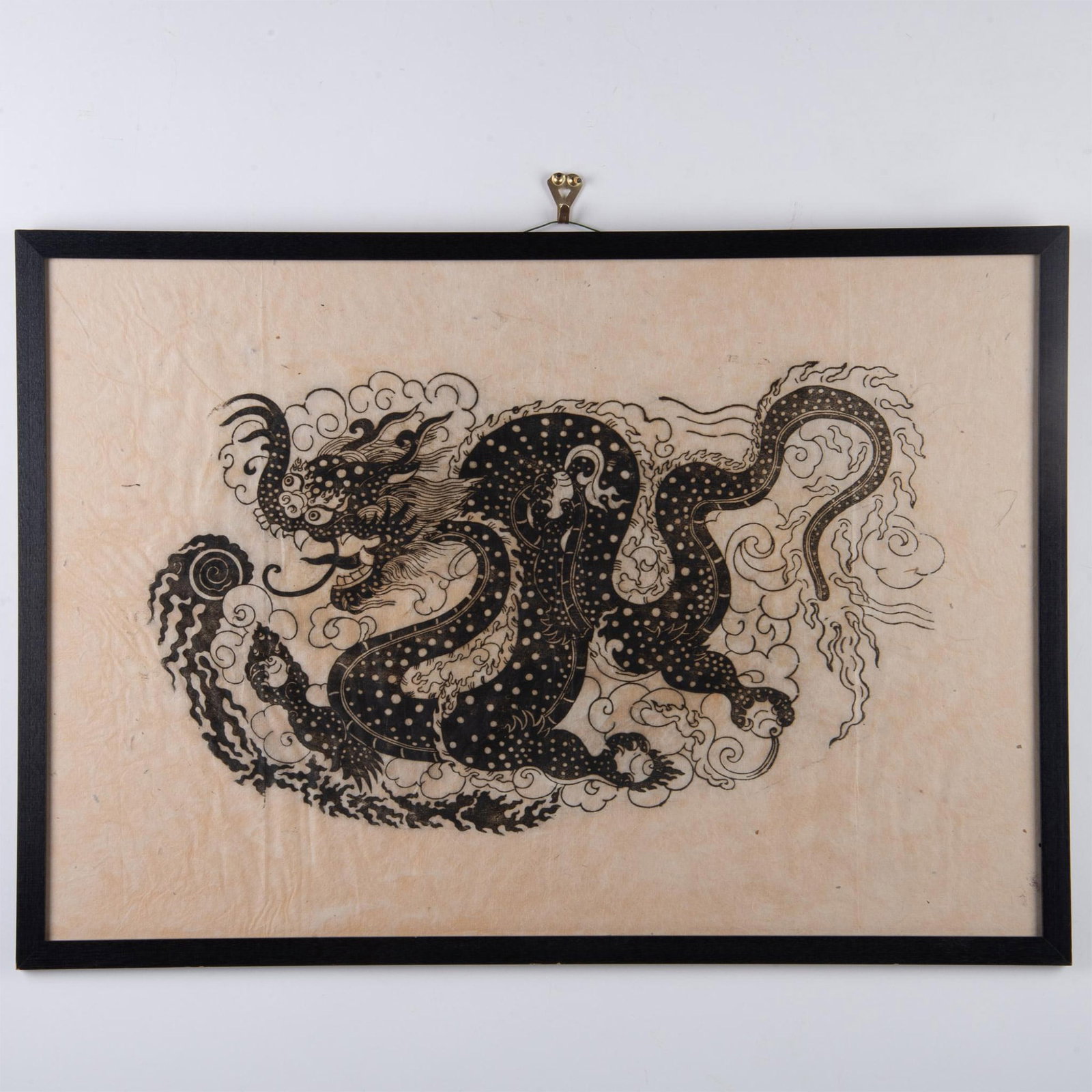 Antique Monochrome Woodcut on Rice Paper, Chinese Dragon: Woodcut with Asian ink, featuring a Chinese dragon as a symbol of good fortune and strength, holding dragon balls with its claws. The black frame matches well with the black ink in the work. Sight dim