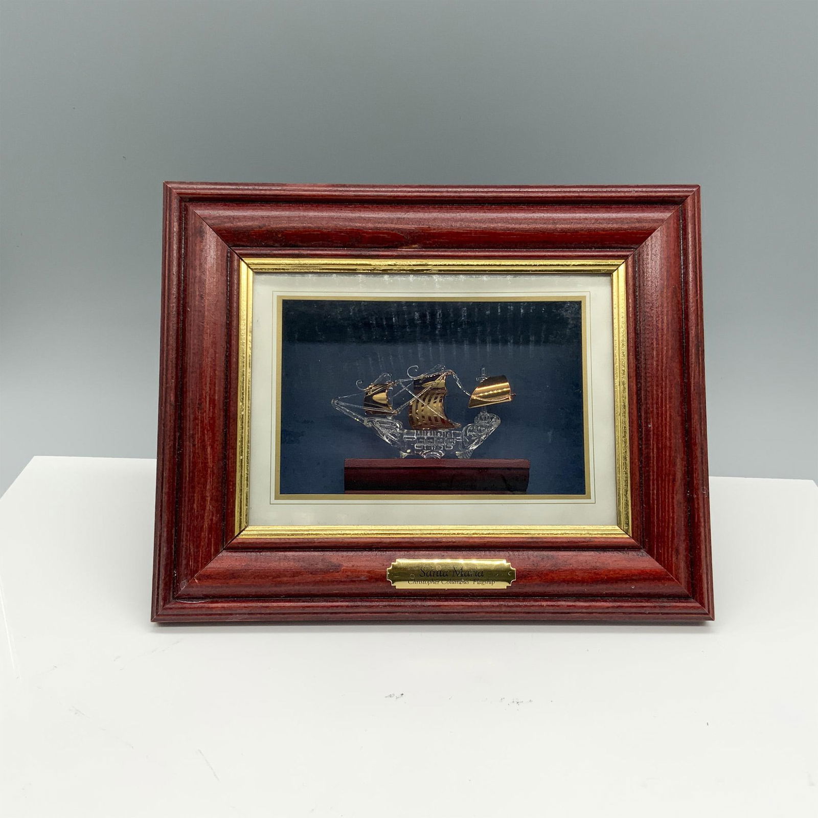 Shadowbox Glass Ship Model, Santa Maria: Intricately crafted 3D box displaying the historic Christopher Columbus flagship. Dimensions: 10"L x 2"W x 8"H Country of Origin: England