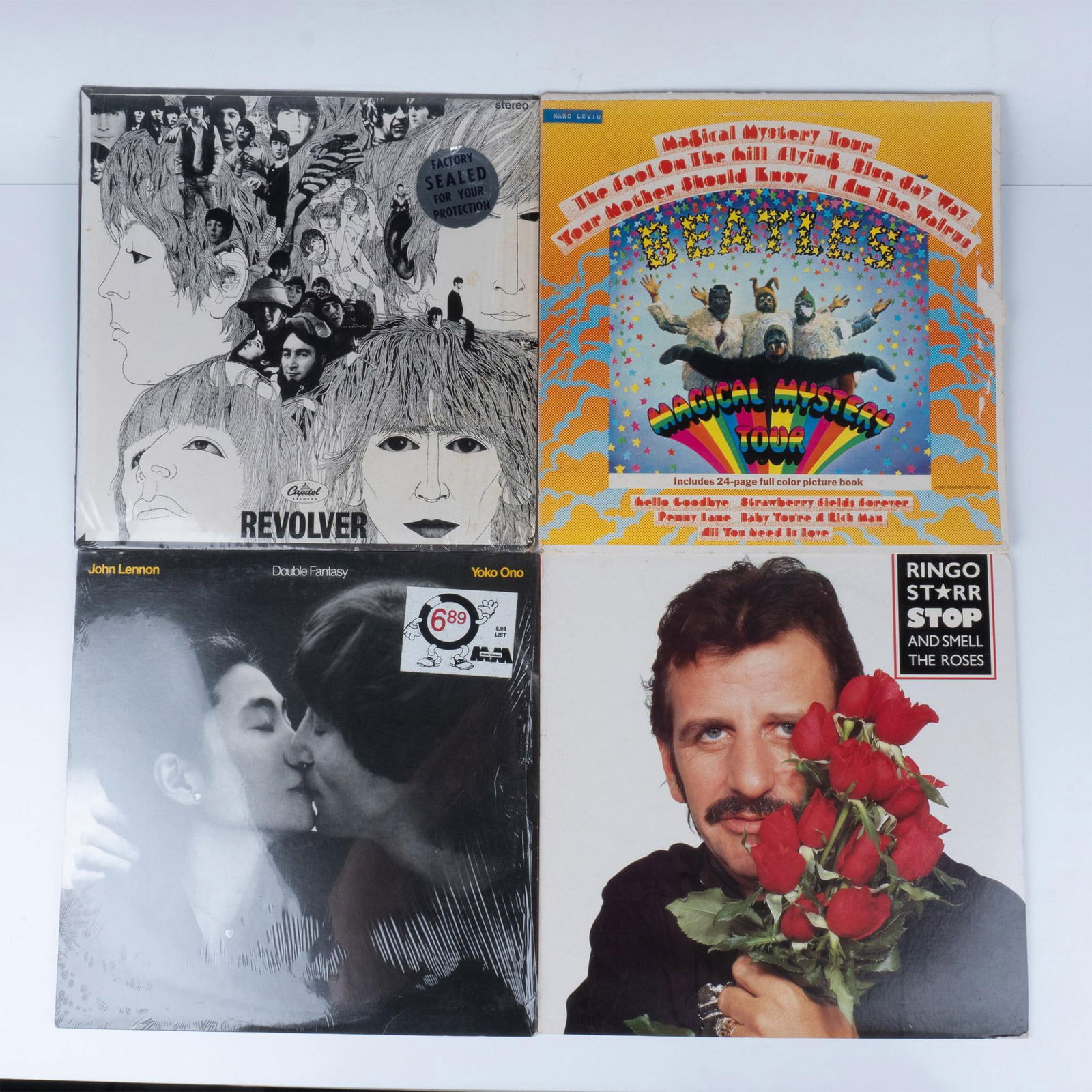 4pc The Beatles, Ringo Star, John Lennon Vinyl Records: This series includes Revolver by The Beatles, issued by Capital Records, Magical Mystery Tour by The Beatles with a color picture book, Stop and Smell the Roses by Ringo star, issued by Broadway recor