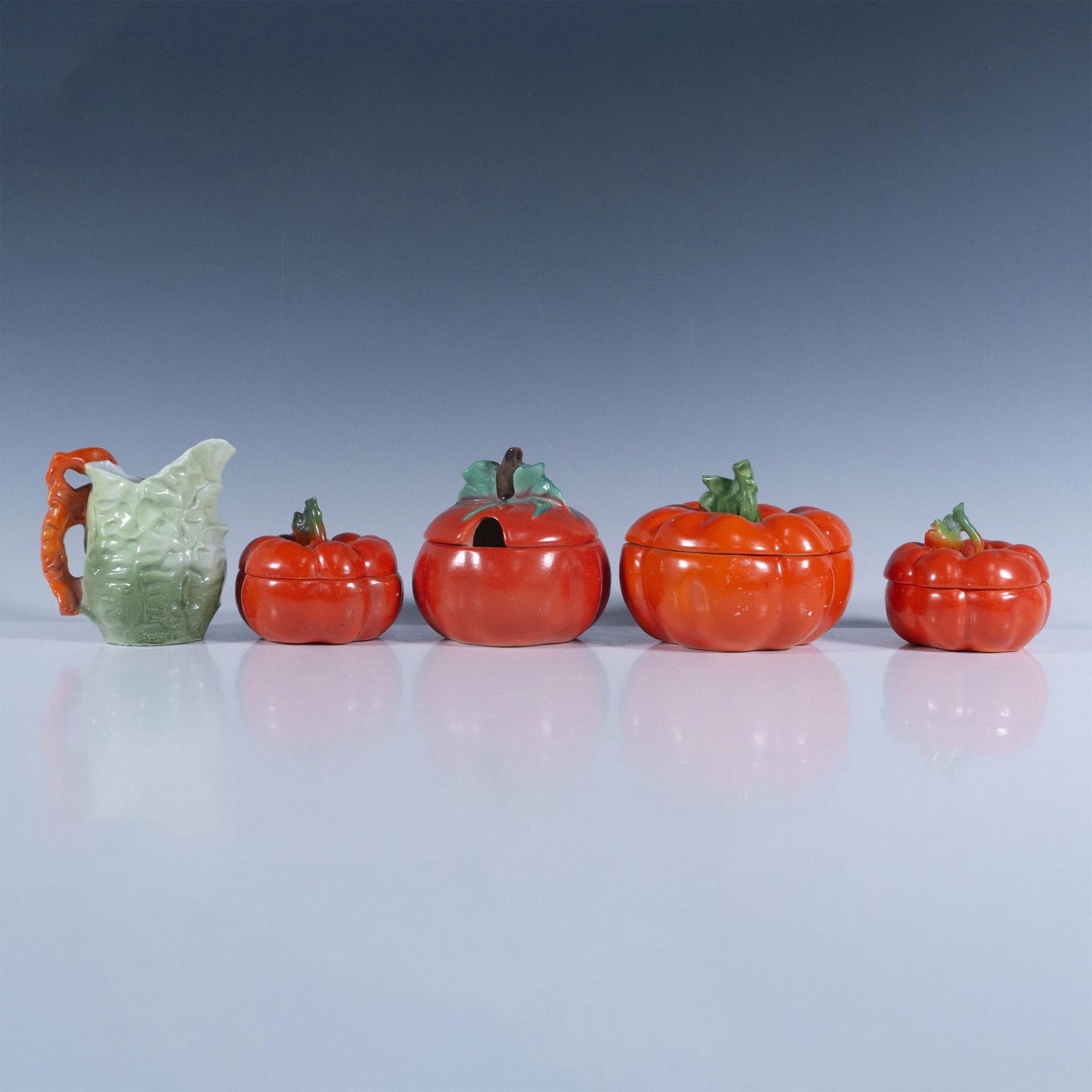 5pc Lot of Royal Bayreuth Bavarian Porcelain Veggie Theme: This collection includes Royal Bayreuth tomato-shaped lidded jars with Royal Bayreuth backstamps, the largest measuring 4.5" L x 4.75" W x 3.75" H. Additionally, the set features a Goebel tomato-shape