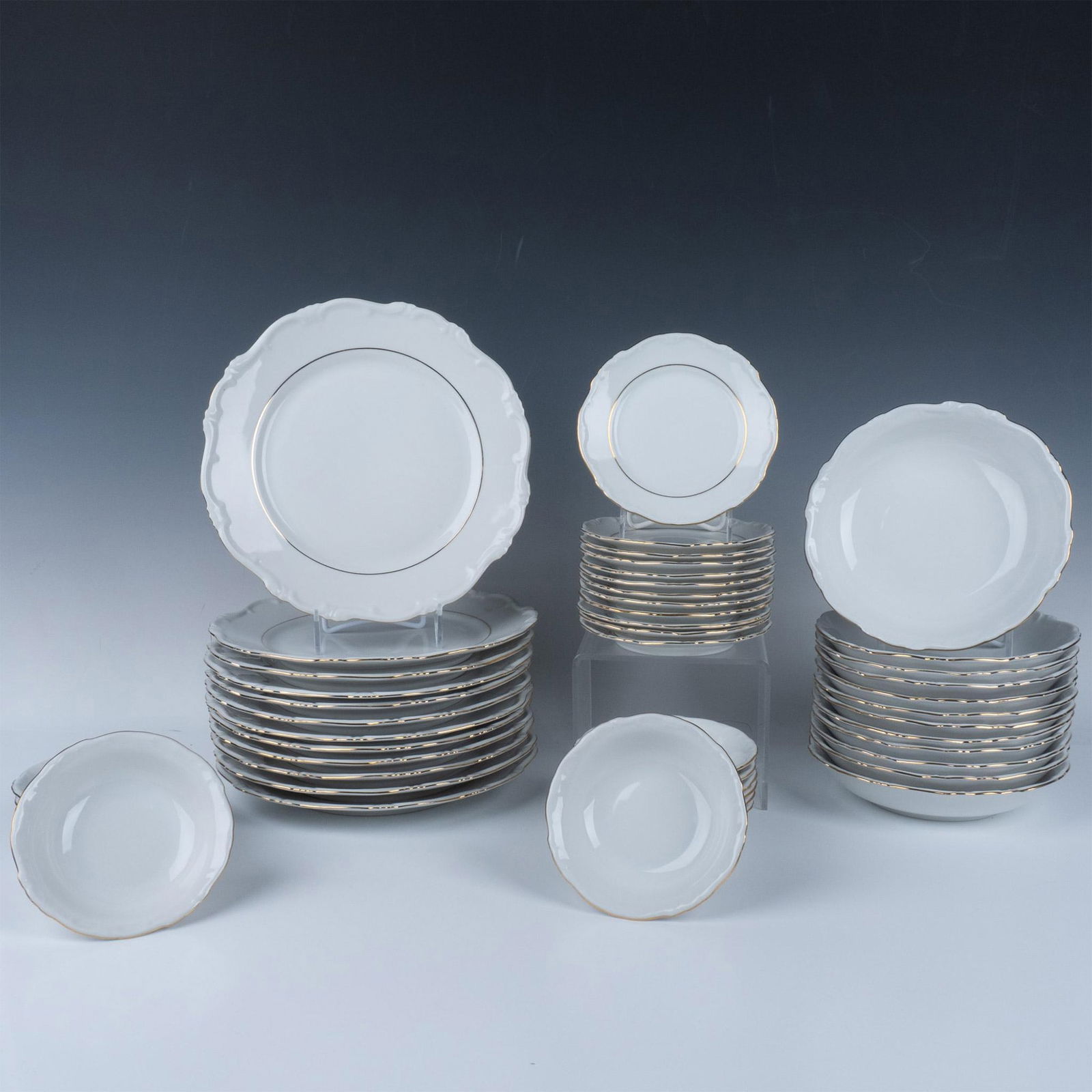 48pc Hertel Jacob Bavaria Porcelain Dinnerware Set: A set for 12 dinneware set featuring gilt edges. (12) Dinner plates: 1.25"H x 10.25" dia. (12) Soup bowls: 1.25"H x 5.5" dia. (12) Bread and butter plates: 1.5"H x 7.75" dia. (12) Dessert plates dimen