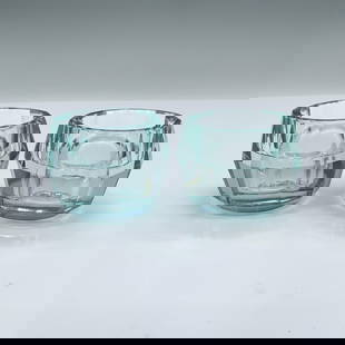 Pair of Orrefors Blue Crystal Totem Harmony Candle Holders: Beautiful candle holders designed by Karim Rashid. They come in their original box which measures 6"L x 3.75"W x 2.75"H. Artist: Karim Rashid Dimensions: 2.5"dia. x 1.75"H Manufacturer: Orrefors Count