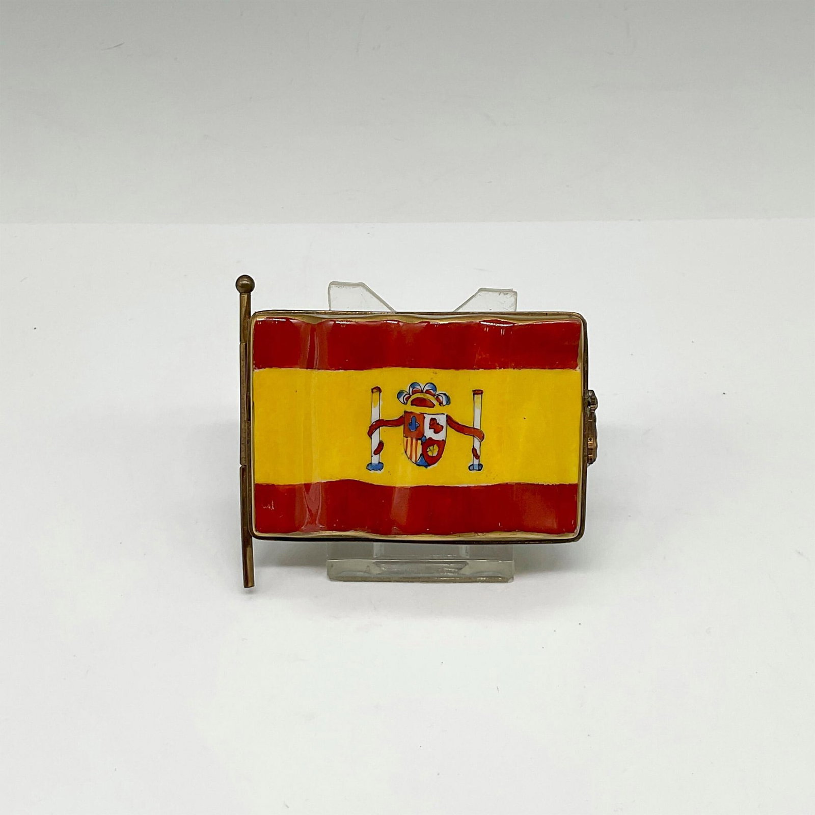 Limoges France Keepsake Box, Spain Flag: Limited Edition hand painted porcelain box shaped as the Flag of Spain with a Cow hinge. Inside the box is a painted outlined map of Spain and the surrounding Countries Portugal and France. Marked by 