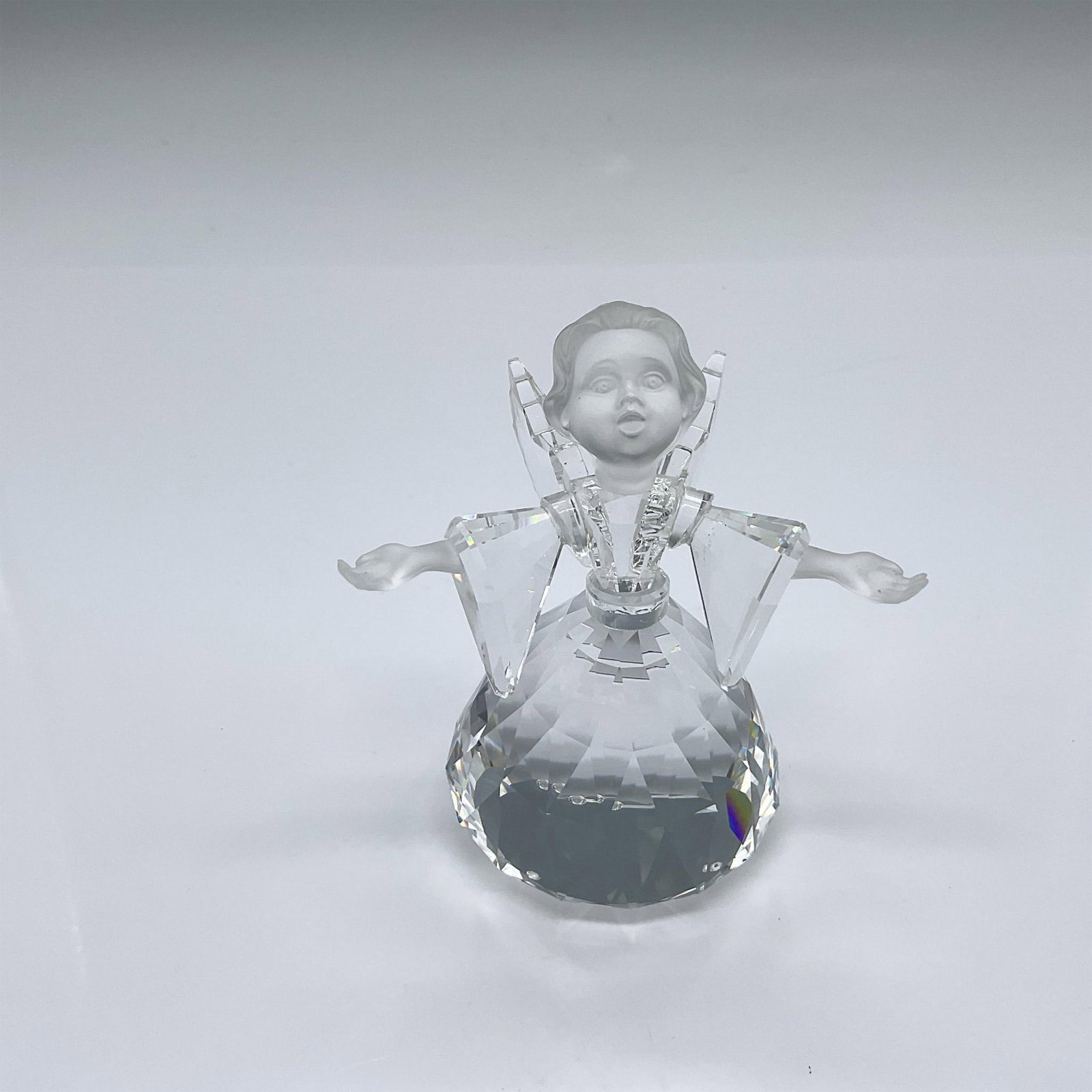 Swarovski Crystal Figurine, Angel - Large: Originally part of the Exquisite Accents collection, later moved to the Cheerful Times group. The angel's wings and dress are made from clear crystals, and her face and hands are frosted. Swarovski sw