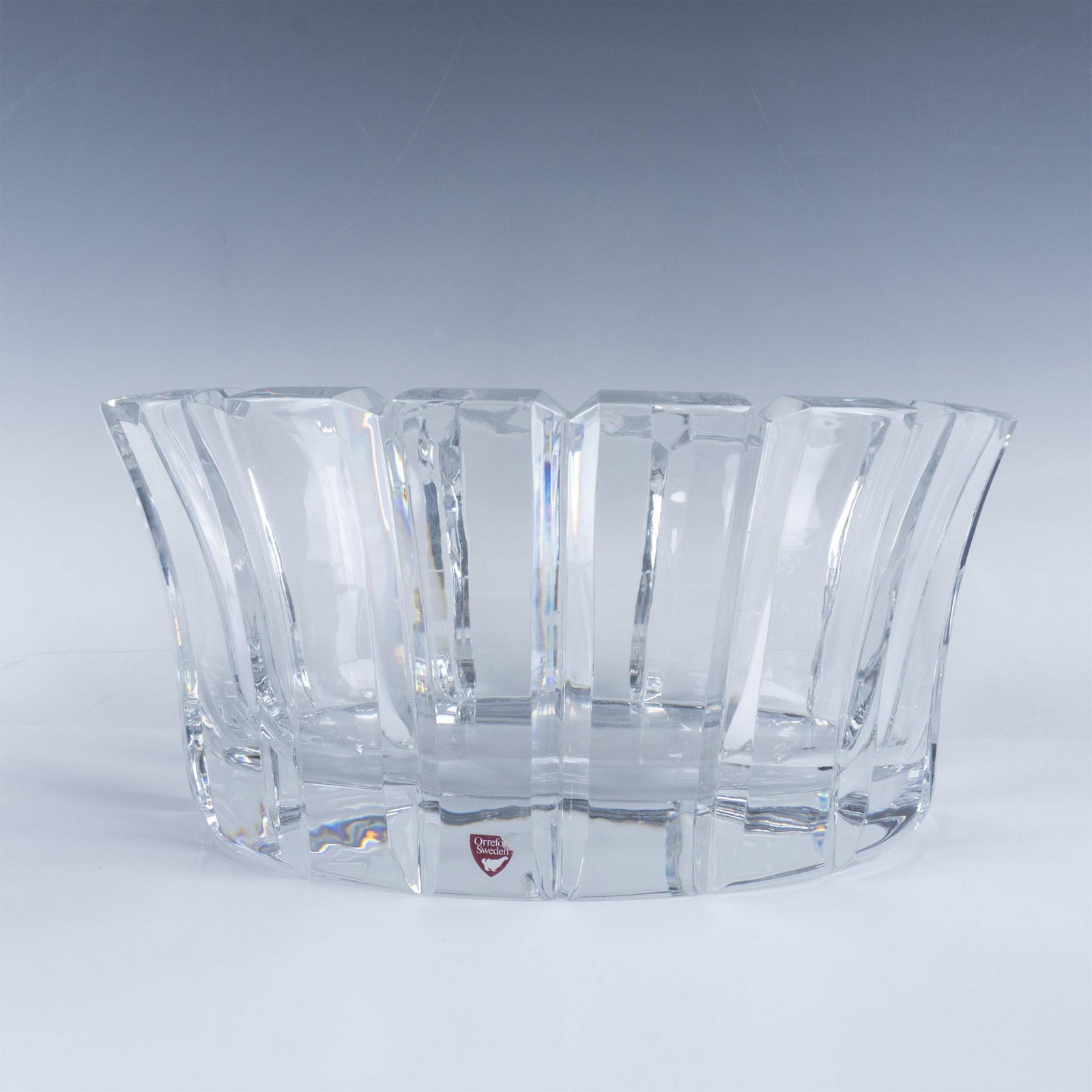 Orrefors Stenhammar Clear Crystal Oval Bowl: Exquisite clear crystal centerpiece bowl, featuring an Orrefors sticker on the lower part. This bowl combines a modern shapes with classic design, seamlessly complementing both contemporary and tradit