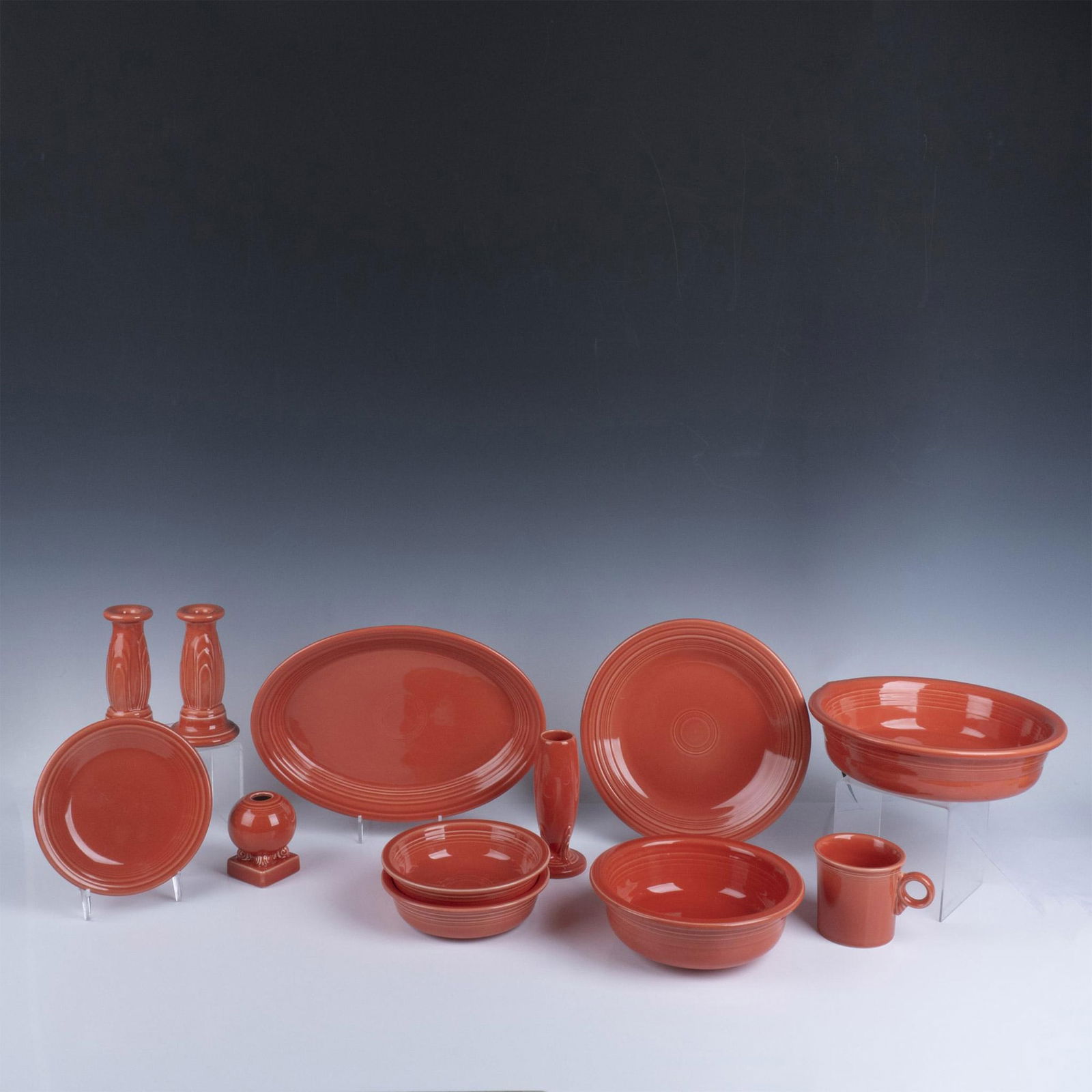 12pc Fiesta Salmon Ceramic Dinnerware Assortment: Extensive and varied pottery consisting of a large oval platter (9.5"L x 13.5"W x 1.75"H), large serving bowl (10.5"W x 3"H), large dinner plate (10.5"W x 1.5"H), large coupe bowl (8.25"W x 3"H), 2 sm