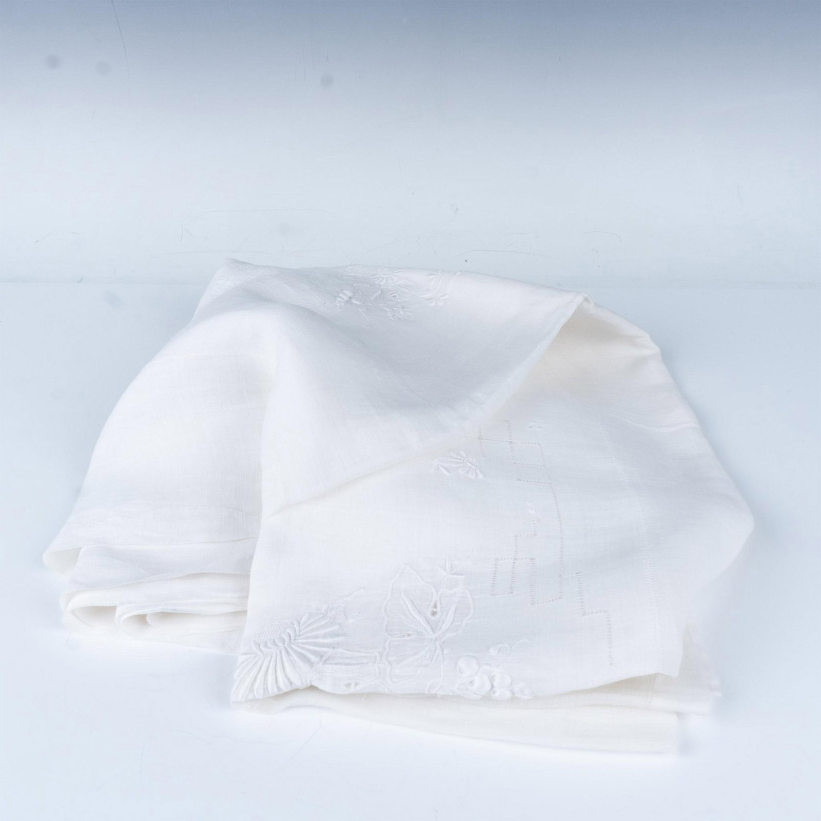 Antique Victorian Drawn Thread Embroidered Tablecloth: This is a gorgeous white linen tablecloth features drawn thread and cutout embroidery in a delicate floral pattern. Dimensions: 80"L x 66"H