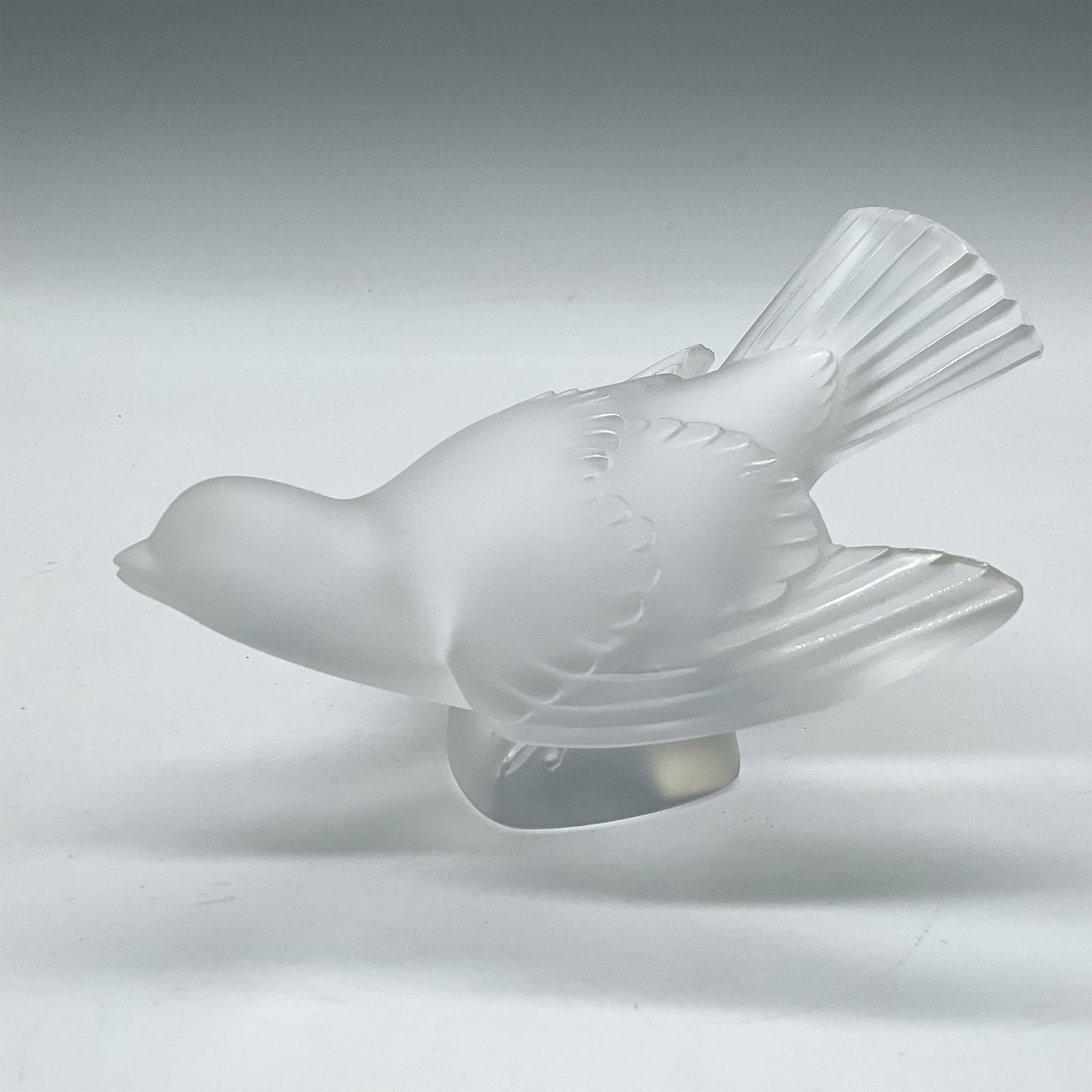 Vintage Lalique Crystal Sparrow Sculpture, Wings Spread: Frosted crystal figure has wings spread as if readying for flight. Lalique France etched mark. Artist: Rene Lalique Issued: c. 1930 Dimensions: 5.25"L x 4"W x 3.5"H Manufacturer: Lalique Country of O