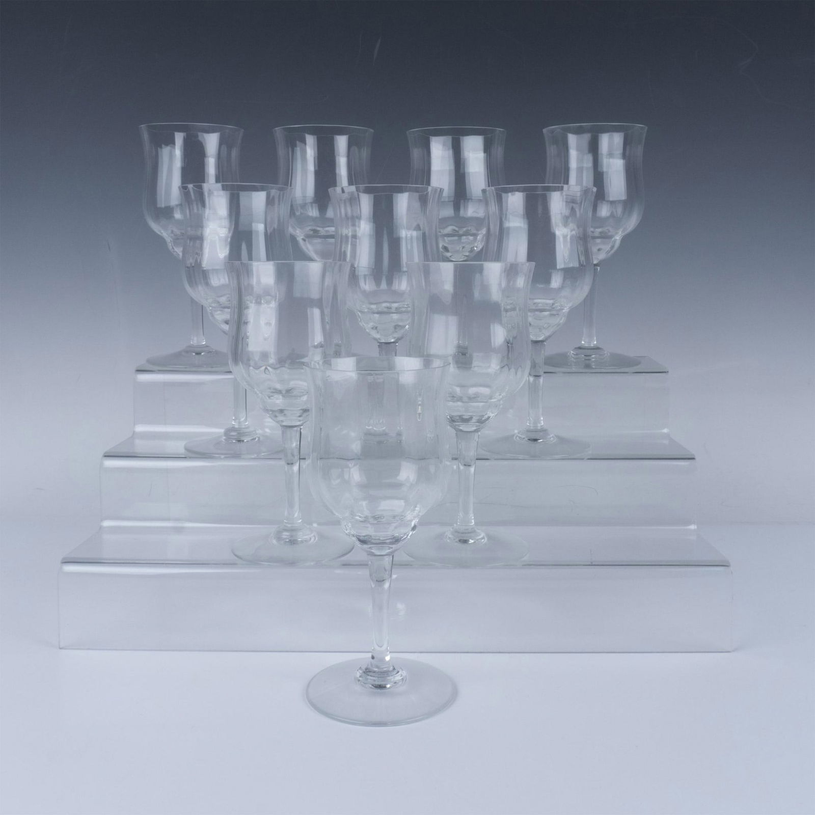 10pc Baccarat Crystal Capri Optic Wine Claret Goblets: Capri wine claret goblets, perfect for elevating any dining experience with their intricate vertical cuts. Baccarat etched marking. Dimensions: 3.25"W x 7"H Manufacturer: Baccarat Country of Origin: F