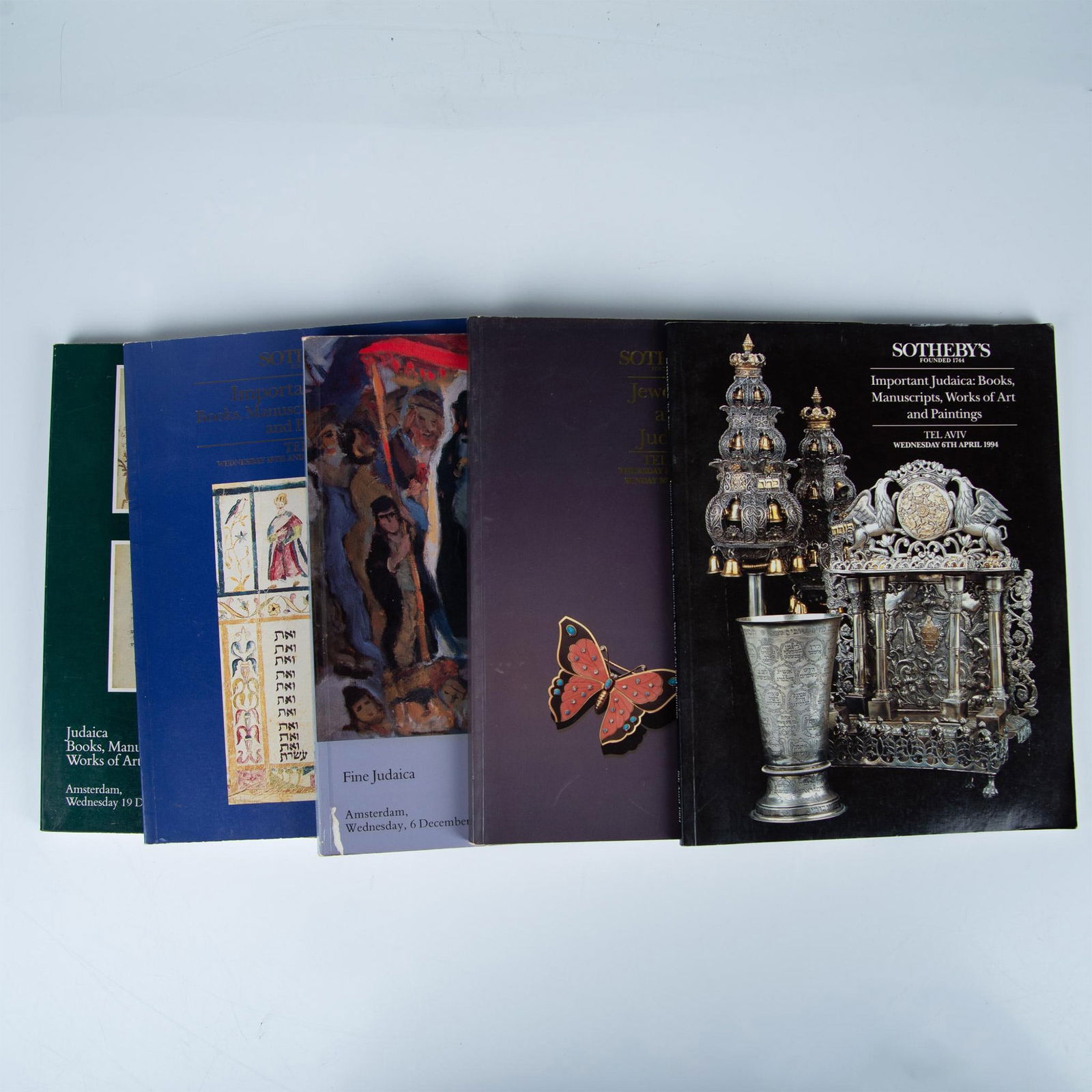 5 Judaica Sotheby's Tel Aviv Auction House Catalogues: Set of five auction house Judaica catalogues published between 1989-1994 by Sotheby's Tel Aviv and Amsterdam. Combined catalogues dimensions: 8.25"L x 10.50"H x 2"W. Issued: 1989-1994 Country of Origi