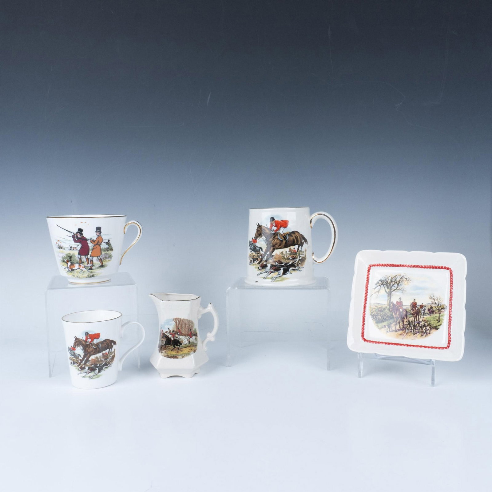 5pc English Porcelain & Bone China Tableware, Hunting Scenes: Various hunting scenes with gilt edges on all. Lot includes small square tray - Sandland Ware; cream jug - unmarked; bone China cup - Crown Trent; mustache mug - Brooks Brothers; and Old Foley beer ju