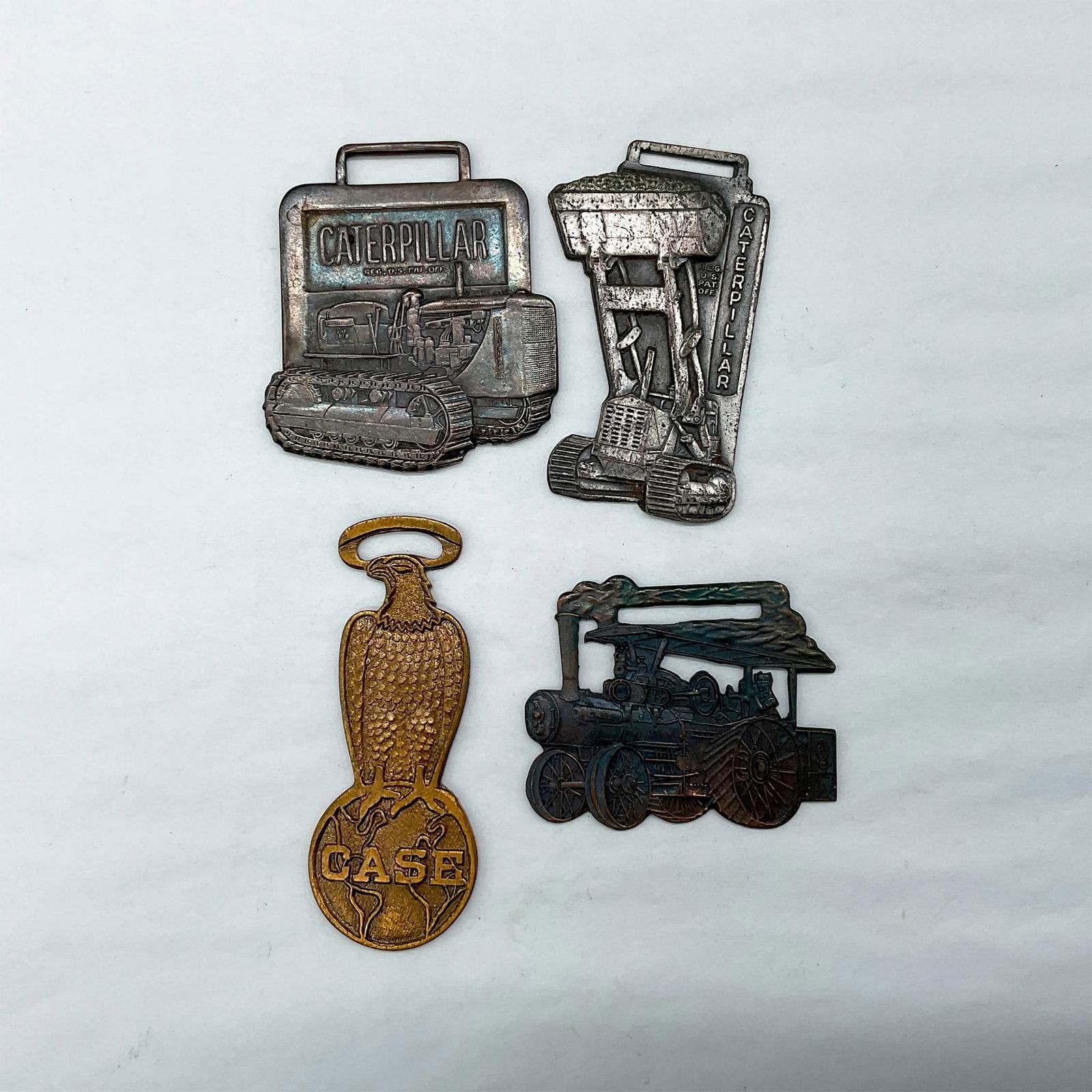 4pc Caterpillar, and Case Watch Fobs (1 of 2)