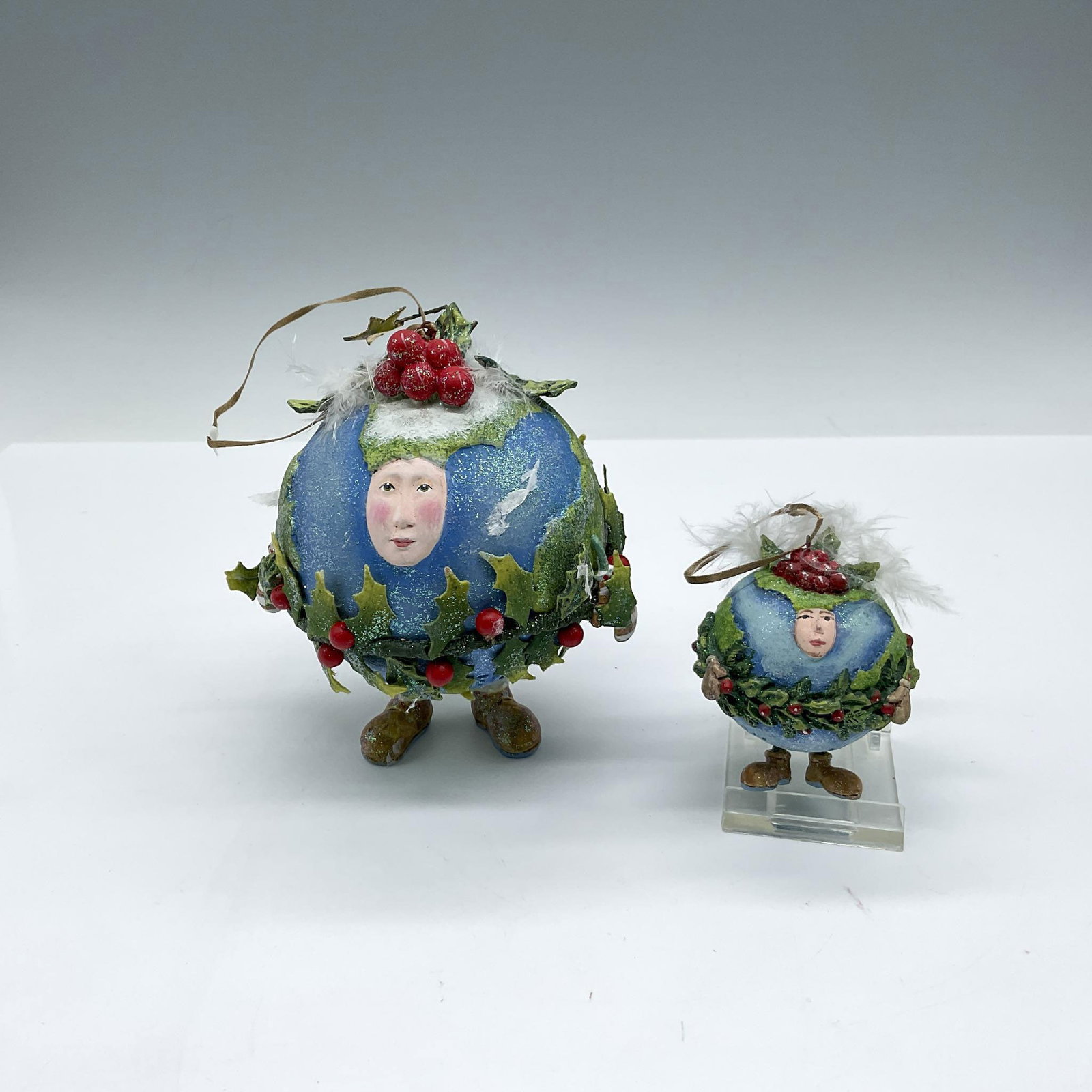 2pc Dept 56 Patience Brewster Ornaments, Peace on Earth: Colorful whimsical globes, large (4.5"H) and small (2.5"H), decorated for the holidays with holly berries. Ready to hang. Dept 56 and PB impressed mark. Largest piece 4.5"H x 3.5" dia. Artist: Patienc