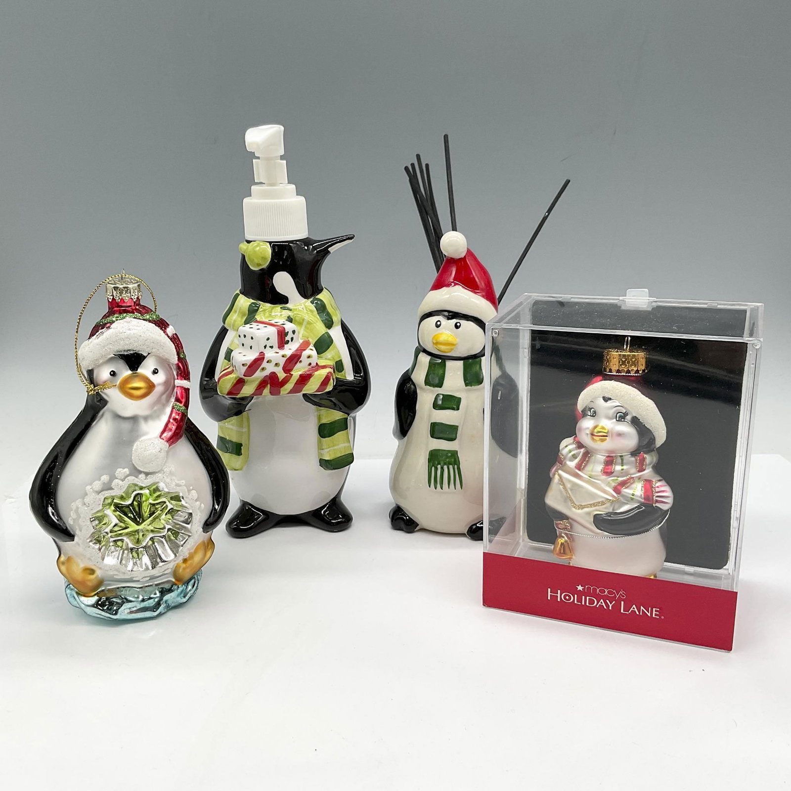 4pc Holiday Penguin Motif Ornaments & Bathroom Accessories: Holiday decor includes Certified International Stephanie Stouffer Penguin soap dispenser and incense stick holder, plus 2 molded glass Penguin ornaments. Made in China. Largest piece 3.5"L x 3.5"W x 8