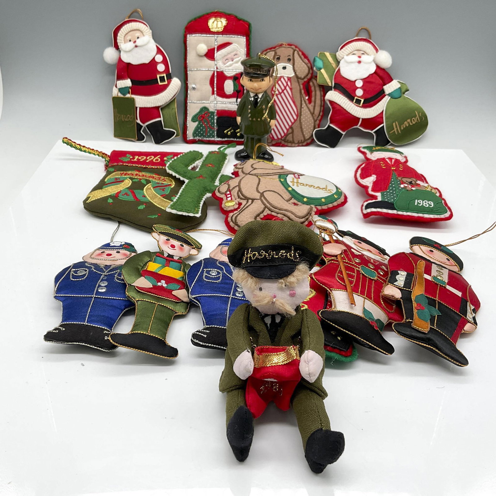 16pc Vintage Harrods Fabric Christmas Ornaments: Large collection of colorful fabric and felt ornaments. Harrods mark. Issued: 1989 - 1996 Dimensions: 3"L x 0.50"W x 6"H Manufacturer: Harrod's Country of Origin: England