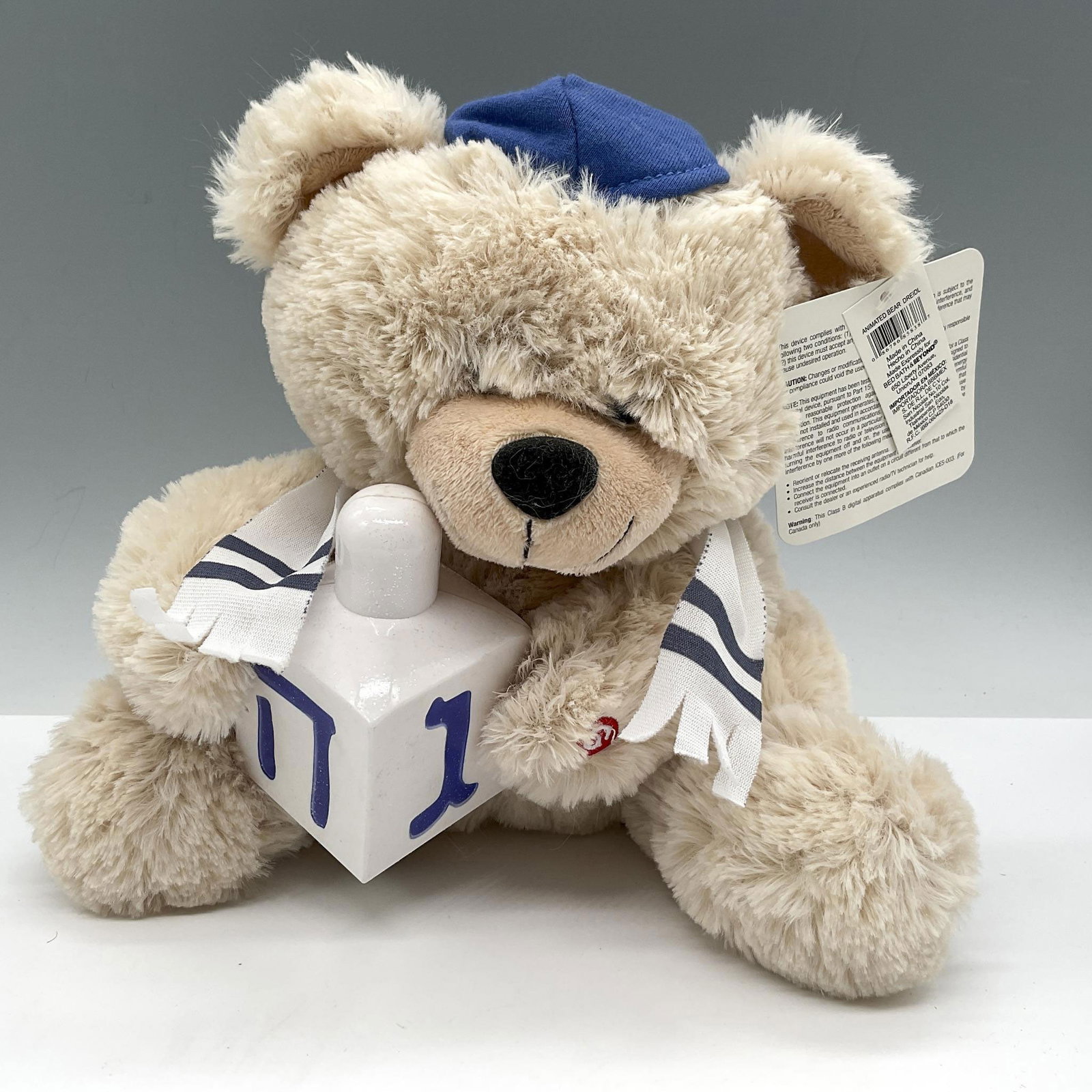 Vintage Gemmy Industries Hannukah Bear: Soft plush cream-colored bear ready for a Hannukah celebration holding his dreidel. Gemmy Ind. tag. Issued: 20th century Dimensions: 9"L x 7"W x 9"H Manufacturer: Gemmy Industries Inc. Country of Orig