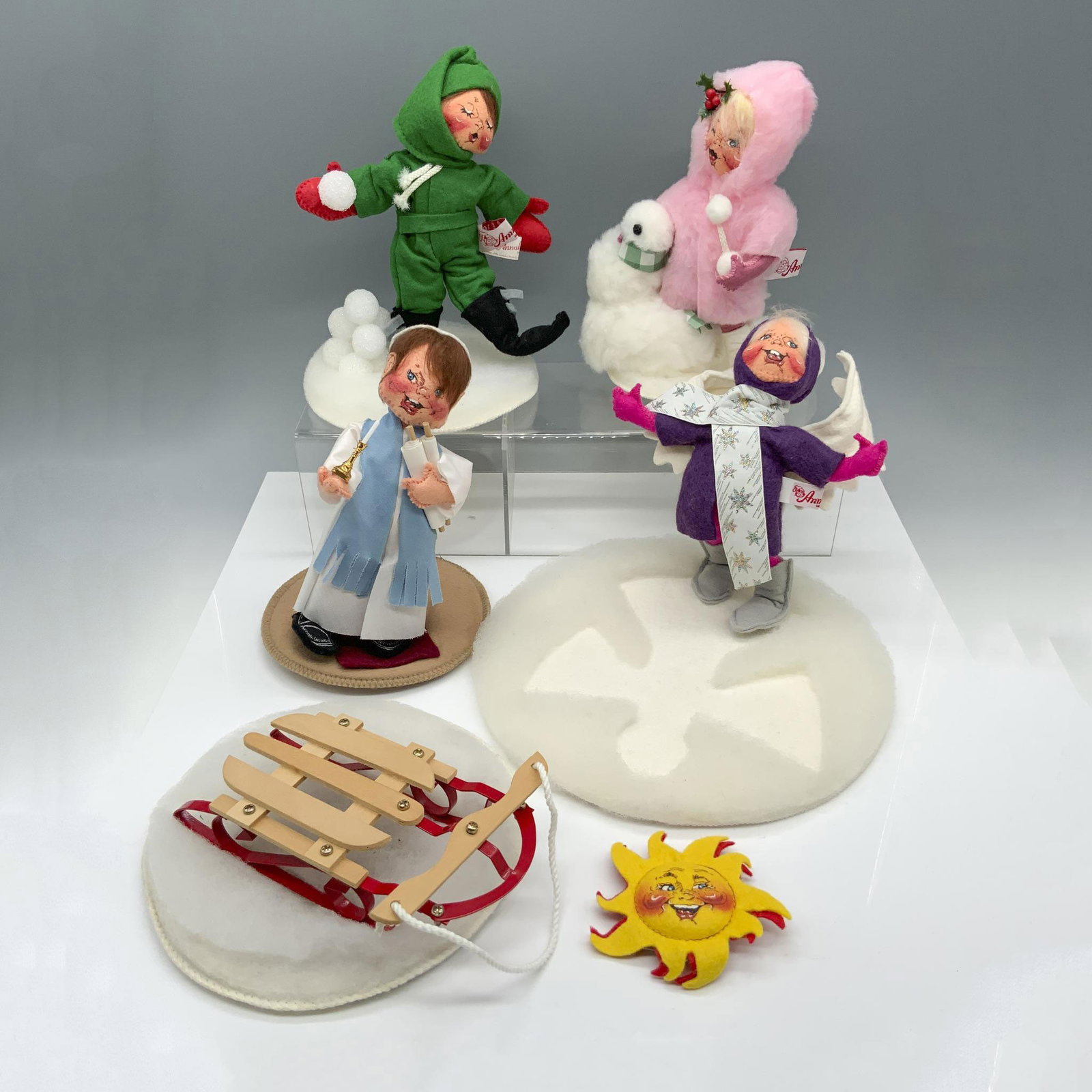 6pc Annalee Winter Figures with a Bar Mitzvah Addition: Gorgeous collection of dolls that includes a child in a green outfit making snowballs, a child in a fluffy pink jacket making a snowman with base signed by Chuck Thorndike, an angel making snow angels