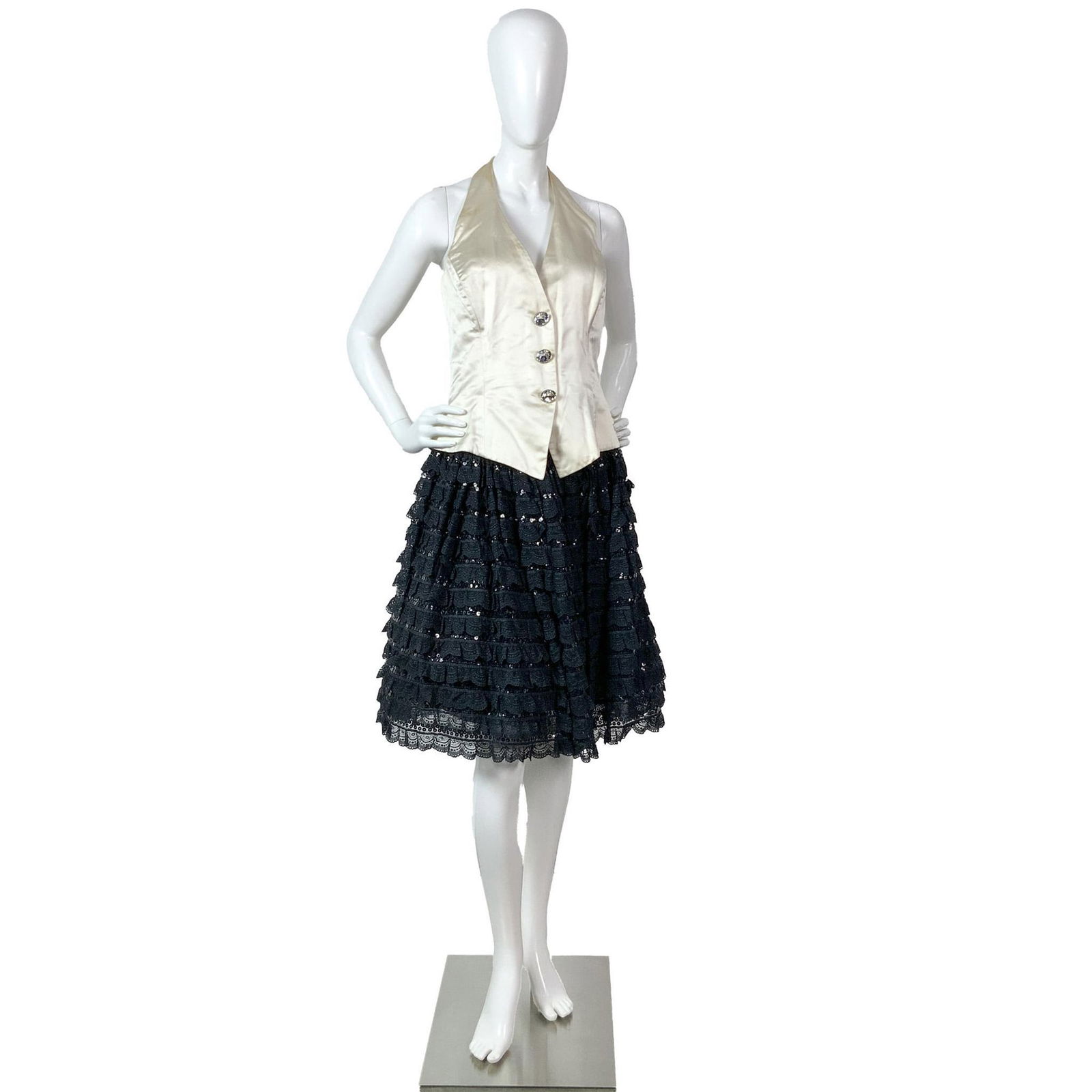 2 pcs Escada Silk Halter Vest & Black sequins Evening Skirt: Two pieces original vintage Escada by Margaretha Ley set featuring a luxurious ivory silk halter vest with three oversize diamond-cut buttons. The black sequined evening skirt is made of three layers