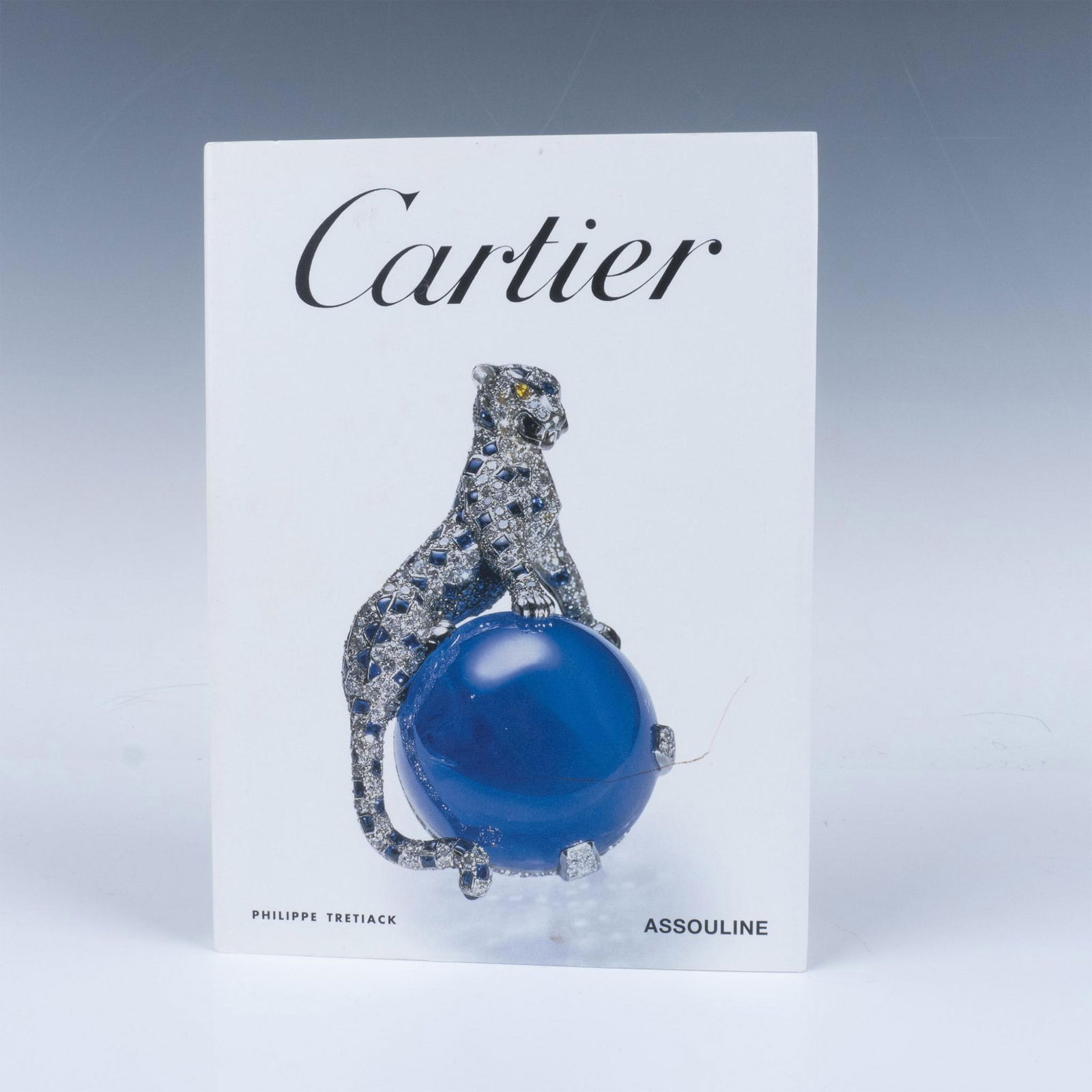 Cartier Philippe Tretiack Book, Cartier: 80 Page hardcover book with a dust jacket, including stunning photographs and insights into the craftsmanship, design, and history of iconic pieces by Cartier. This book features an illustrated select