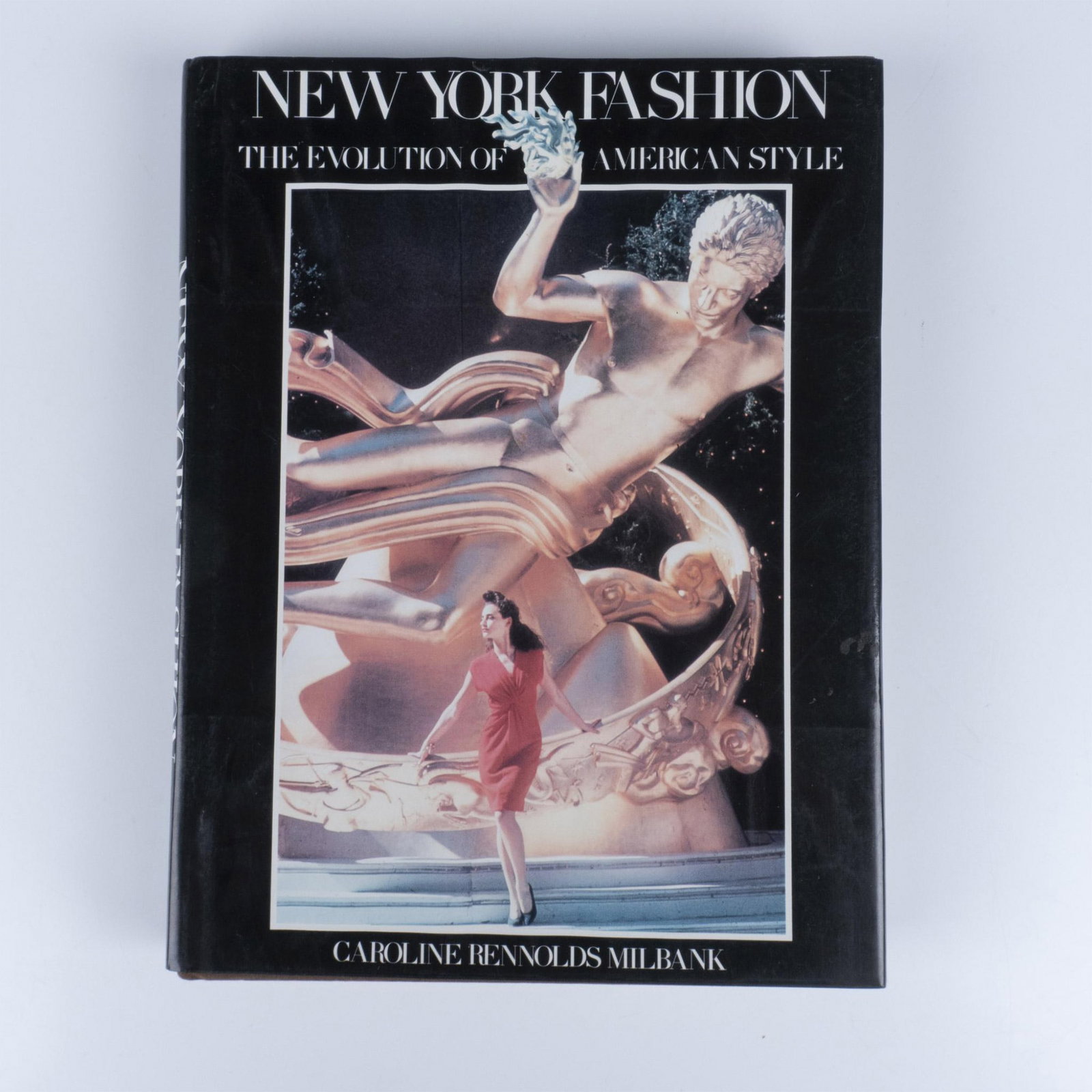 Caroline Rennolds Milbank Book, New York Fashion: 298 page hardcover book with a dustcover, conveying a history of American fashion through the lens of New York City. This book traces the evolution of style from past to present, showing how New York 