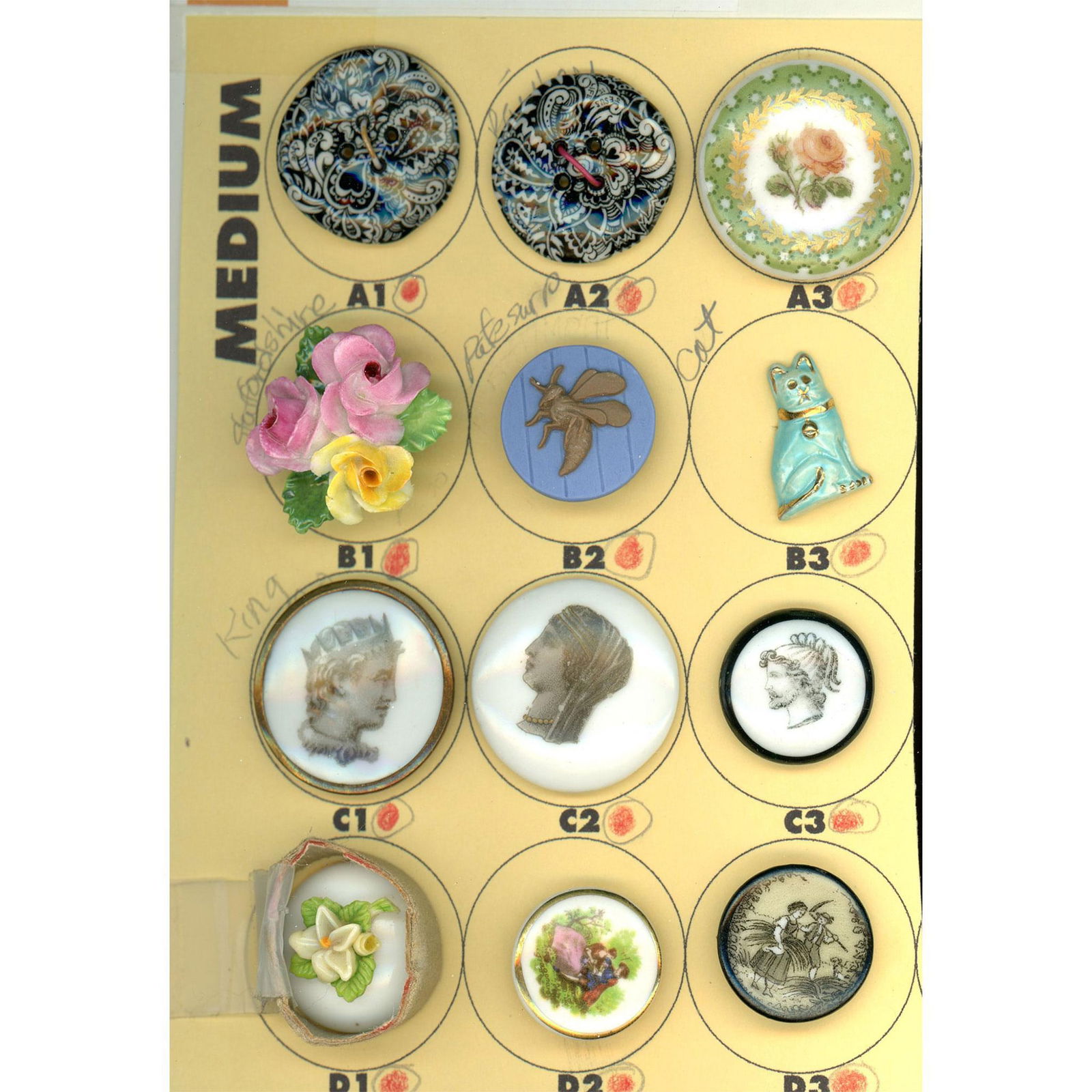 A small card of division 1 & 3 assorted ceramic buttons (1 of 4)