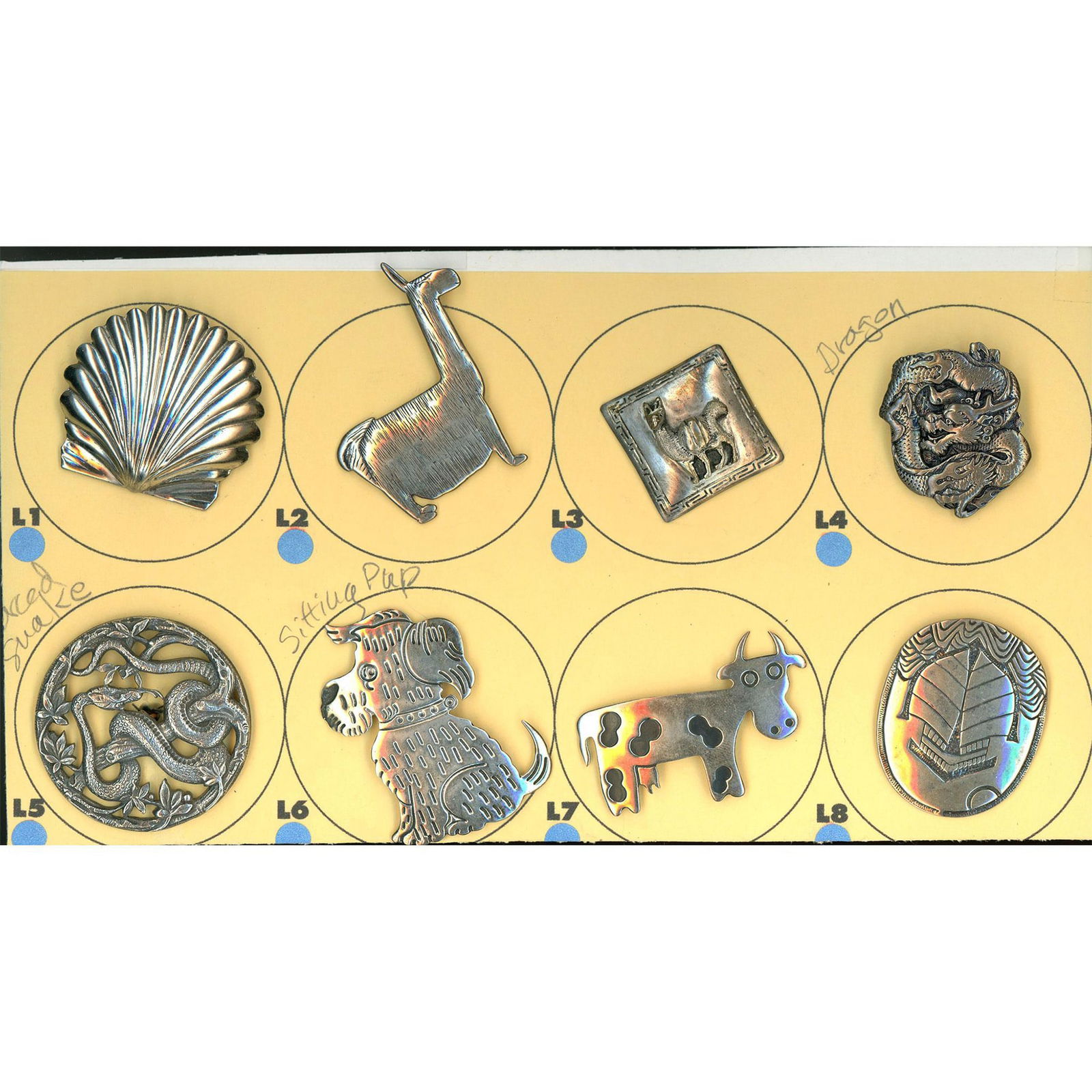 A partial card of div. 1 & 3 assorted silver buttons (1 of 4)