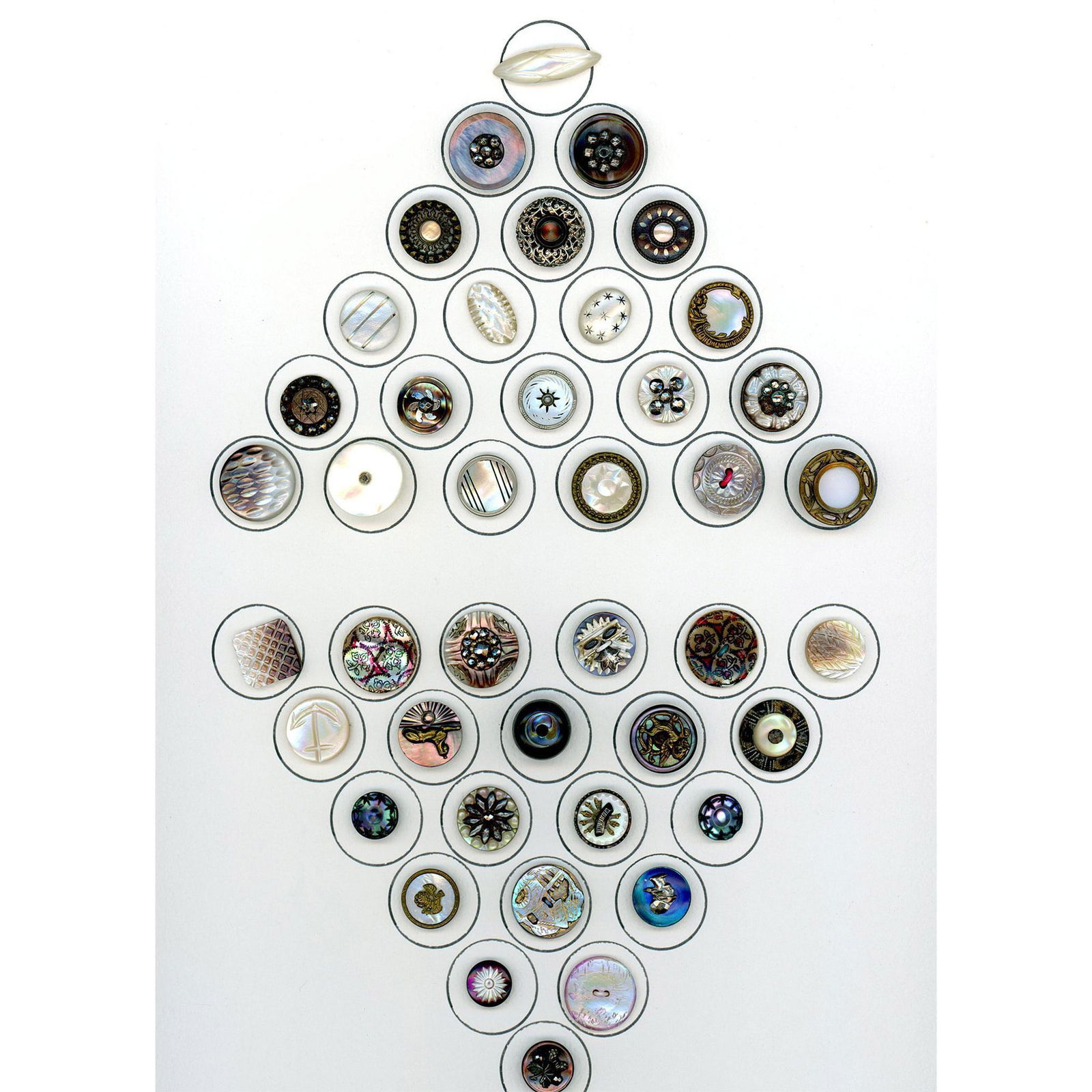 A card of assorted division one pearl buttons (1 of 3)