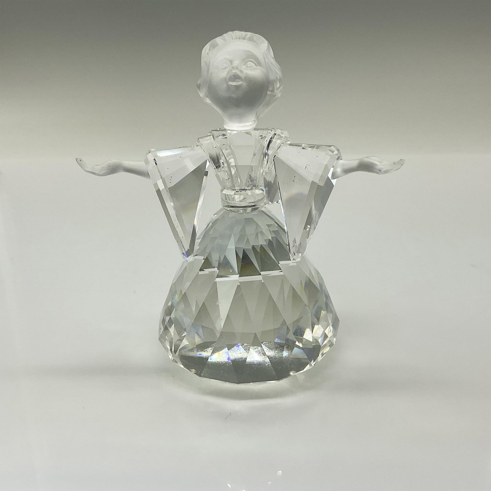 Swarovski Crystal Figurine, Angel 194761: This Swarovski crystal angel is made from clear crystal with frosted face and hands. Originally part of the Exquisite Accents collection, the Angel was later moved to the Cheerful Times theme group. S