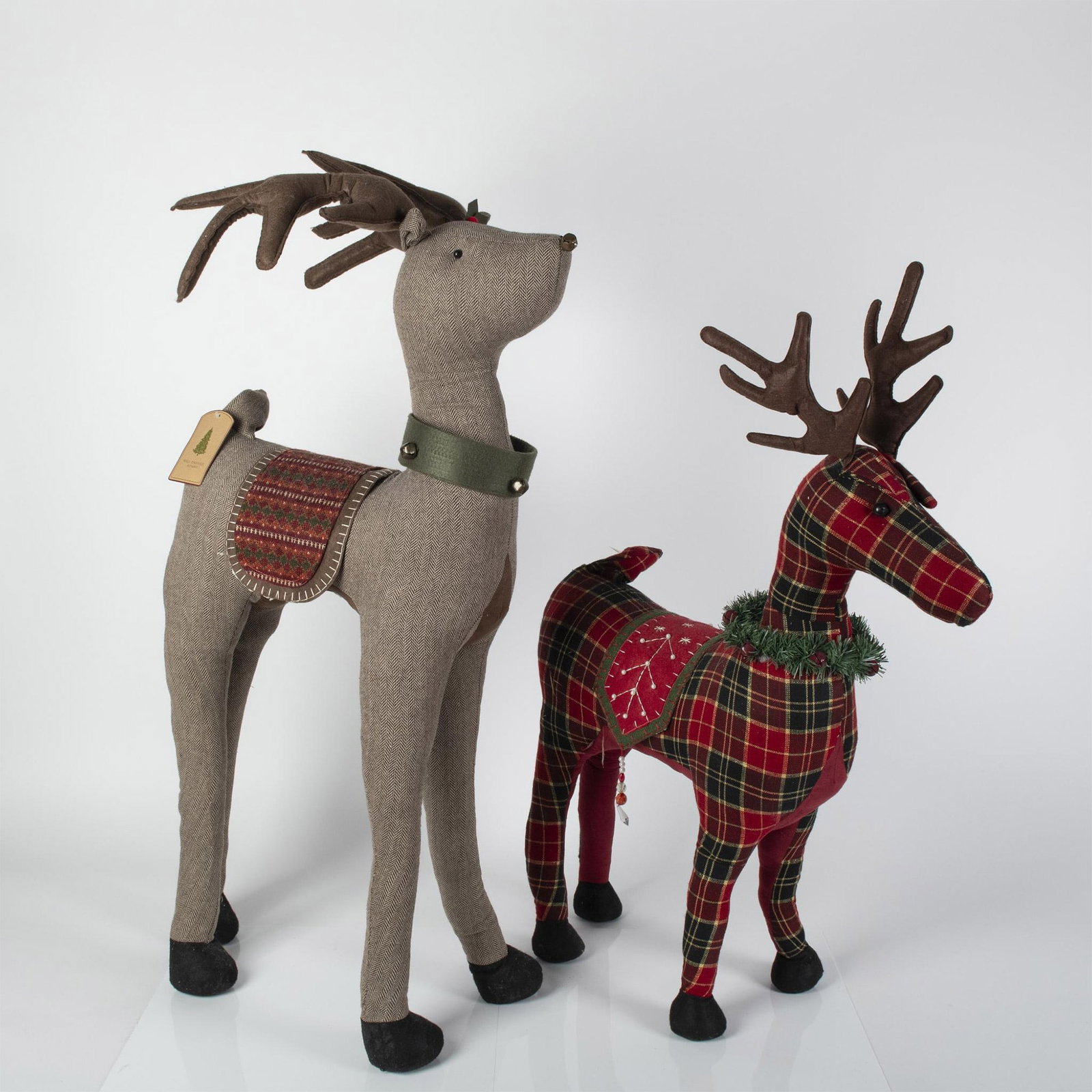 2pc Well Dressed Home Nordic Woodland Christmas Reindeers: For your Holiday indoor decor these tweed and felt fabric designed Holiday reindeers are perfect. The large brown tweed figure with bell collar measures 21"L x 9"W x 42"H and medium burgundy plaid wit