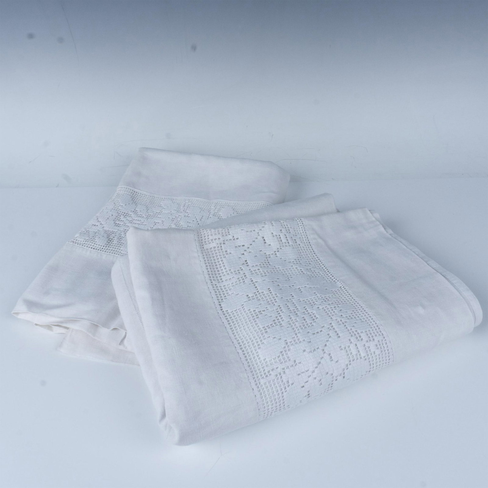 2pc Vintage Linen Flat Single Bedsheets Decorative Stitching: This pair of linen sheets has a decorative floral stitched border and embroidered initials. Issued: 20th century Dimensions: 103"L x 90"W