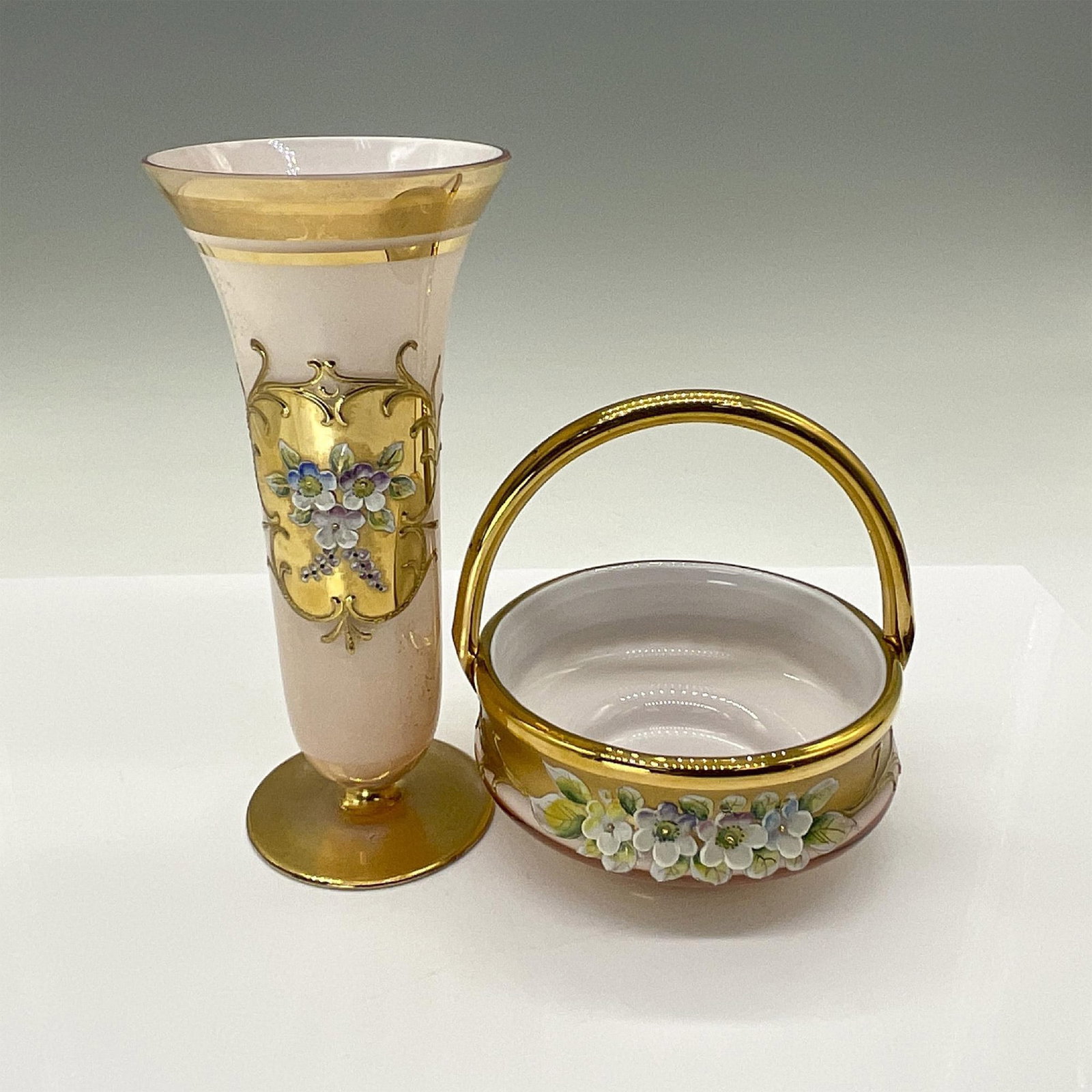 2pc Czech / Bohemian Painted Glass Vase and Basket: This beautiful pair of painted pink glass is adorned with raised relief enameled flowers and embossed gold motifs. Vase measures 7"H. The basket measures 4.75"Dia. x 5"H. Issued: 20th century Dimensio