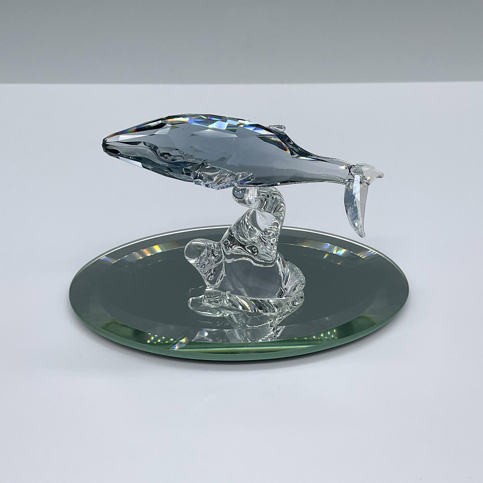 Swarovski Crystal Figurine and Base, Paikea Young Whale: Paikea the Young Humpback Whale. SCS 2012 Annual Edition. Crafted from Shadow crystals with Moonlight crystal fins. The name Paikea is also the Maori name for southern humpback whales. The figure incl