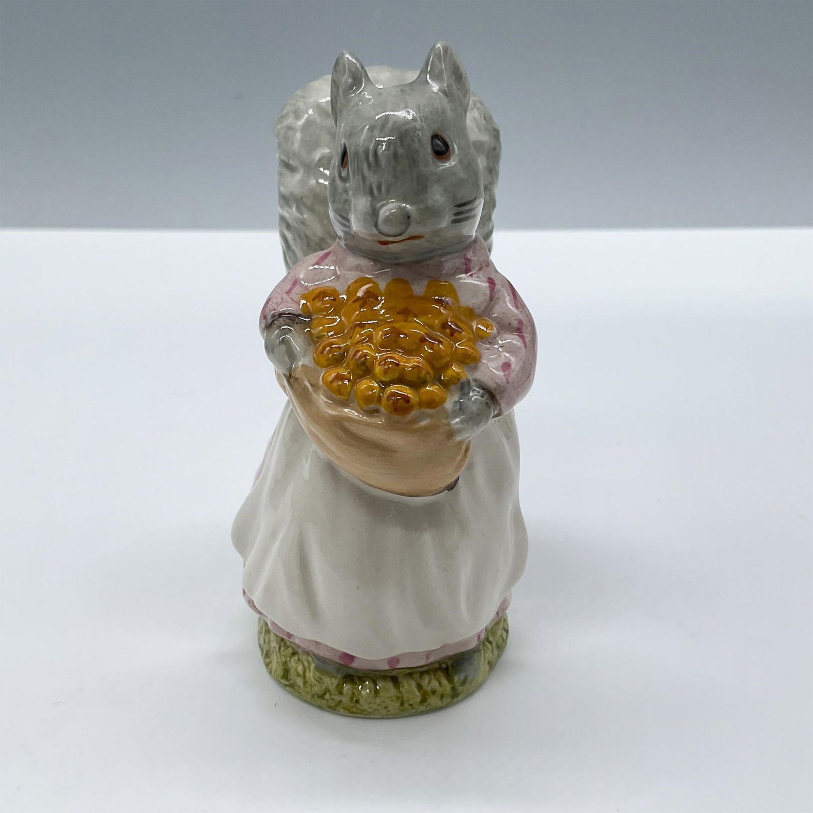 Royal Albert Beatrix Potter Figurine, Goody Tiptoes: Glazed finish. Modeled in pink, gray and yellow colors, Royal Albert backstamp. Issued: c. 1989 Dimensions: 2.5''L x 1.5''W x 3.5''H Manufacturer: Royal Albert Country of Origin: England
