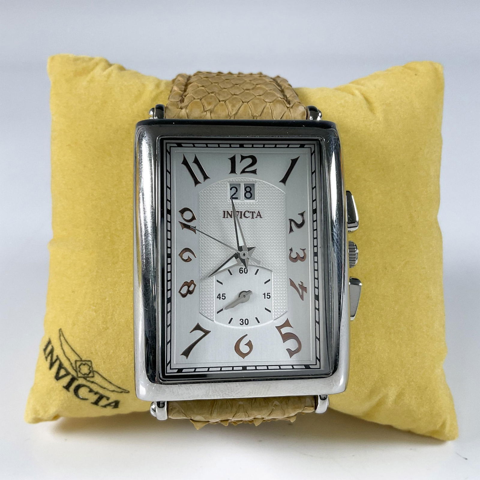 Invicta Men's 2606 Vintage Collection Celestial Wristwatch: This sophisticated men's wristwatch has a quartz face encased by a stainless steel back. The elegant strap is from the genuine python Swiss collection. The watch comes in a box that is 4.5"L x 6"W x 3