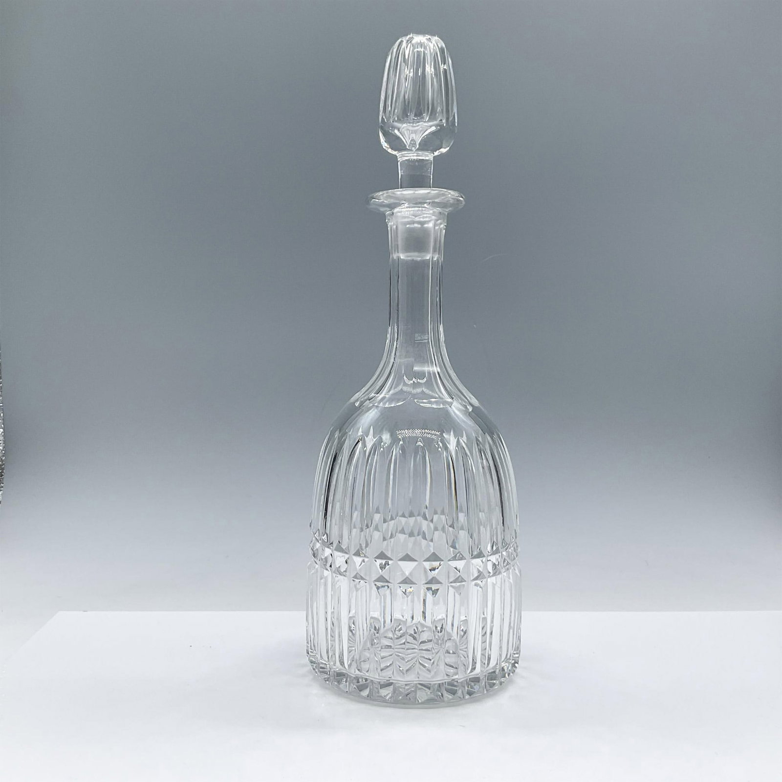 Royal Brierley Crystal Wine Decanter w/ Stopper: Elegant clear crystal decanter with stopper designed in a sleek cut pattern. Royal Brierley etched backstamp. Issued: 20th century Dimensions: 12.75''H x 4.25''dia Manufacturer: Royal Brierley Country