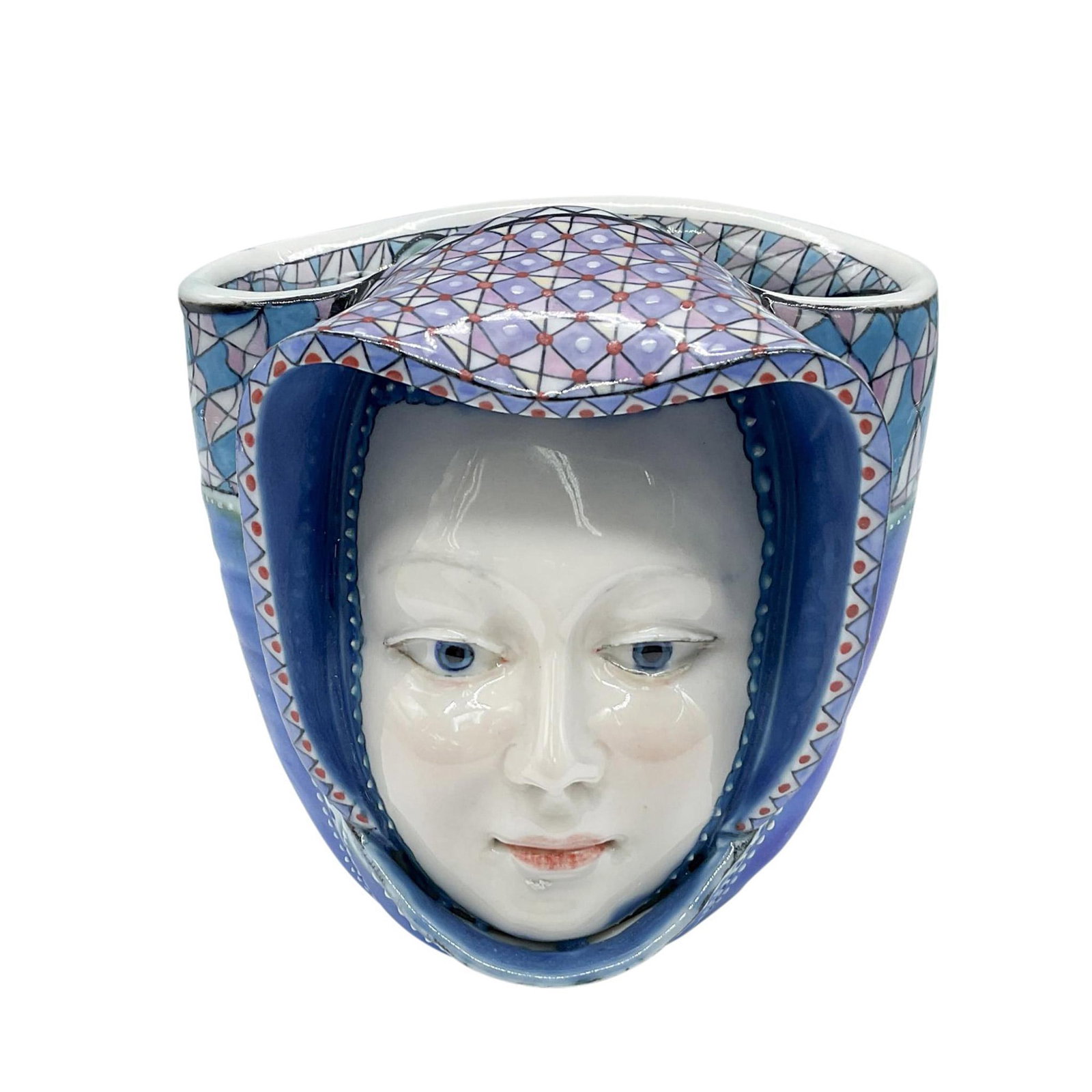 David Burnham Smith Unique Mask Face Vase: Hand crafted and hand decorated uniquely patterned vase modeled with a face on the front. Blue, purple, and red colorations. Marked DBS June 2013. Artist: David Burnham Smith Issued: 2013 Dimensions: