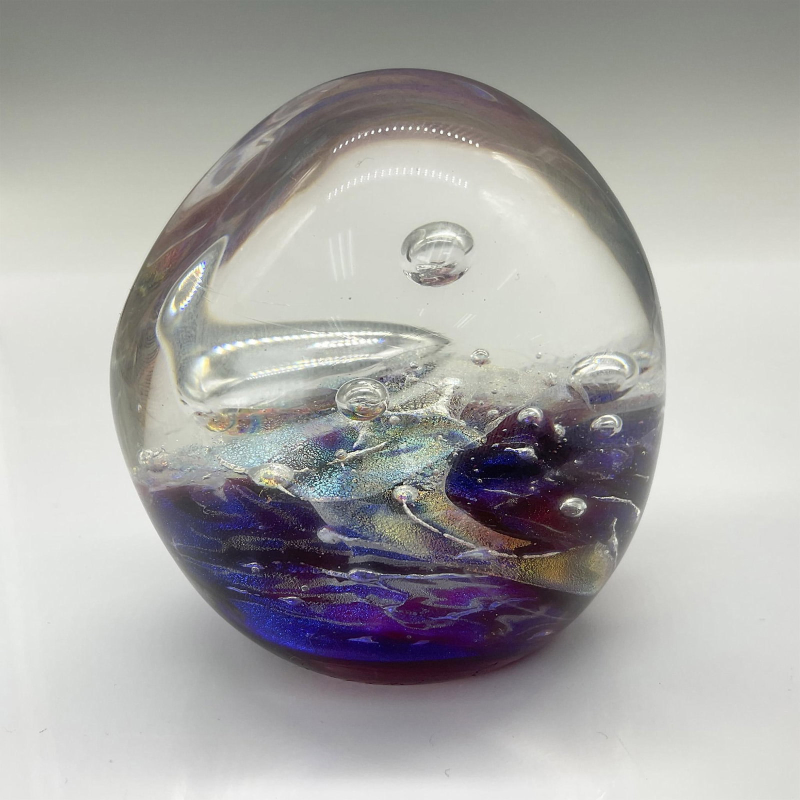 Rebecca Stewart Hand Blown Dichromatic Glass Paperweight: Rebecca Stewart's dichromatic molten glass sculptures blend watercolor-like fluidity with sculptural structure and light play. Her paperweight sculptures, celebrated for their dynamic color shifts, ar