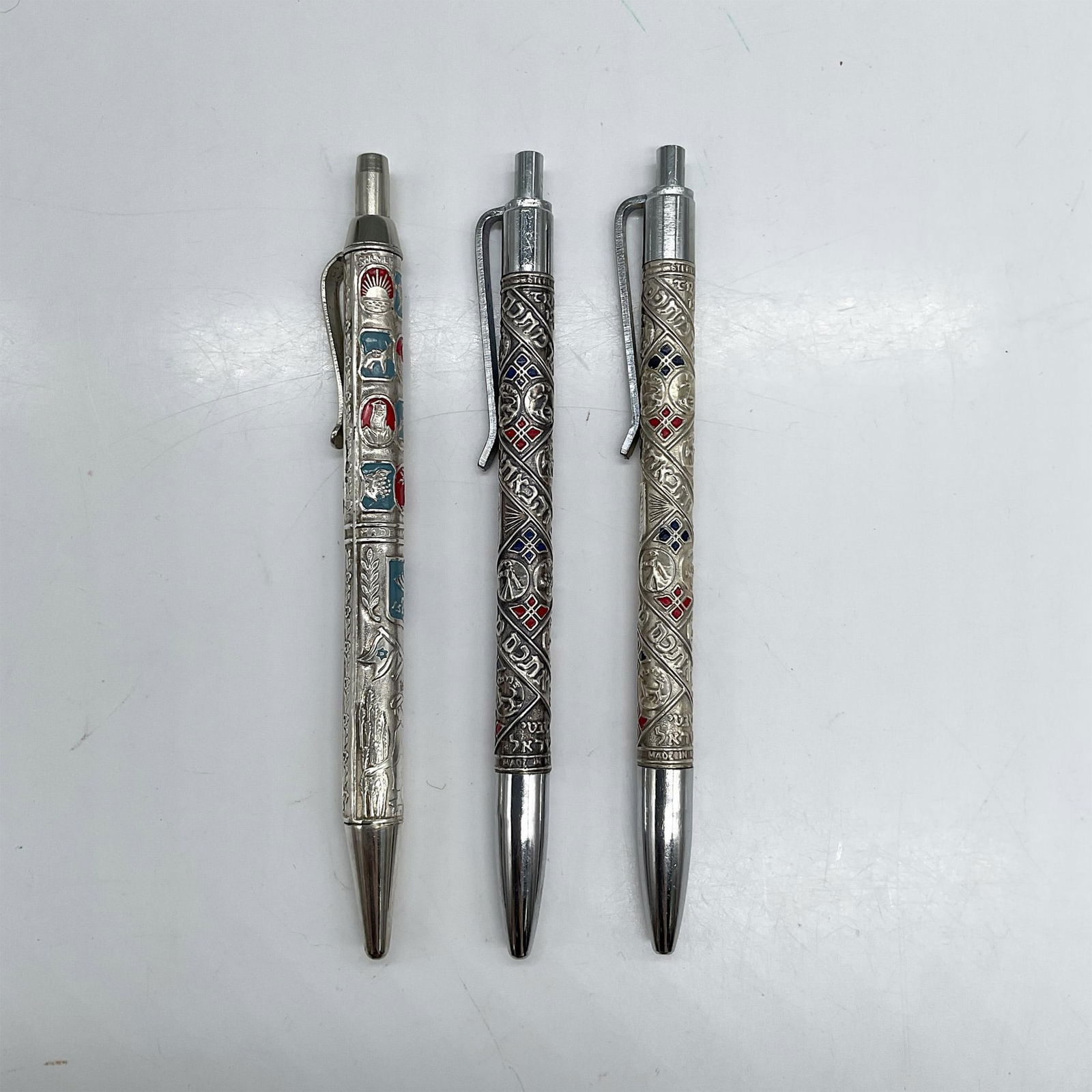 3pc Vintage Israeli Sterling Silver Judaica Pens: Two Silverolex Tribes Of Israel pens marked sterling silver. One Ideal pen with Judaica symbols marked silver. Dimensions: 5.75"L