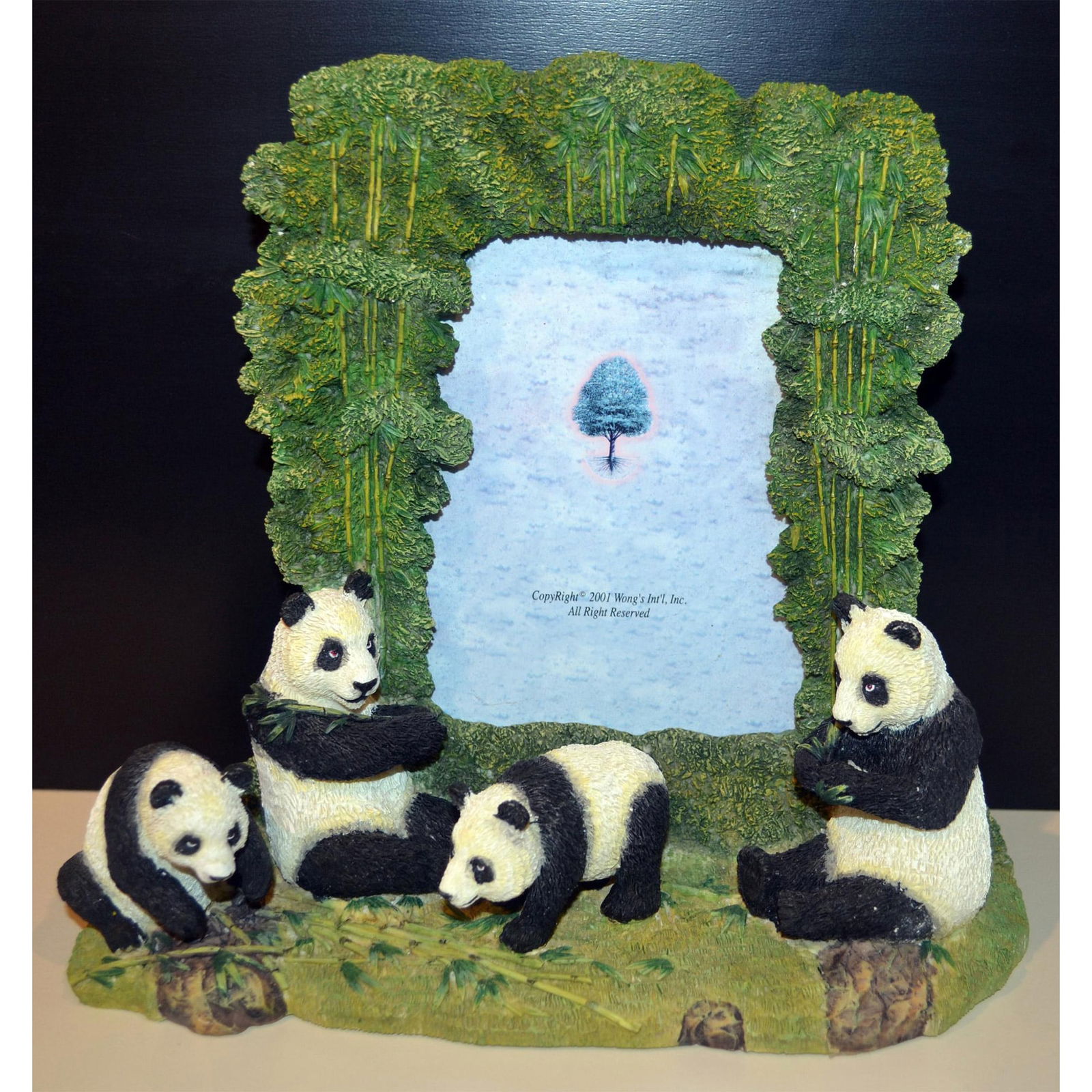 Wong's Panda Bears Decorative Picture Frame, 9"H: A Decorative Picture Frame featuring Four Panda Bears in Black and White and in Three Dimension Sitting, Reclining , Standing and Eating Bamboo. All featured Panda's on the Base of the Frame. Hand cre