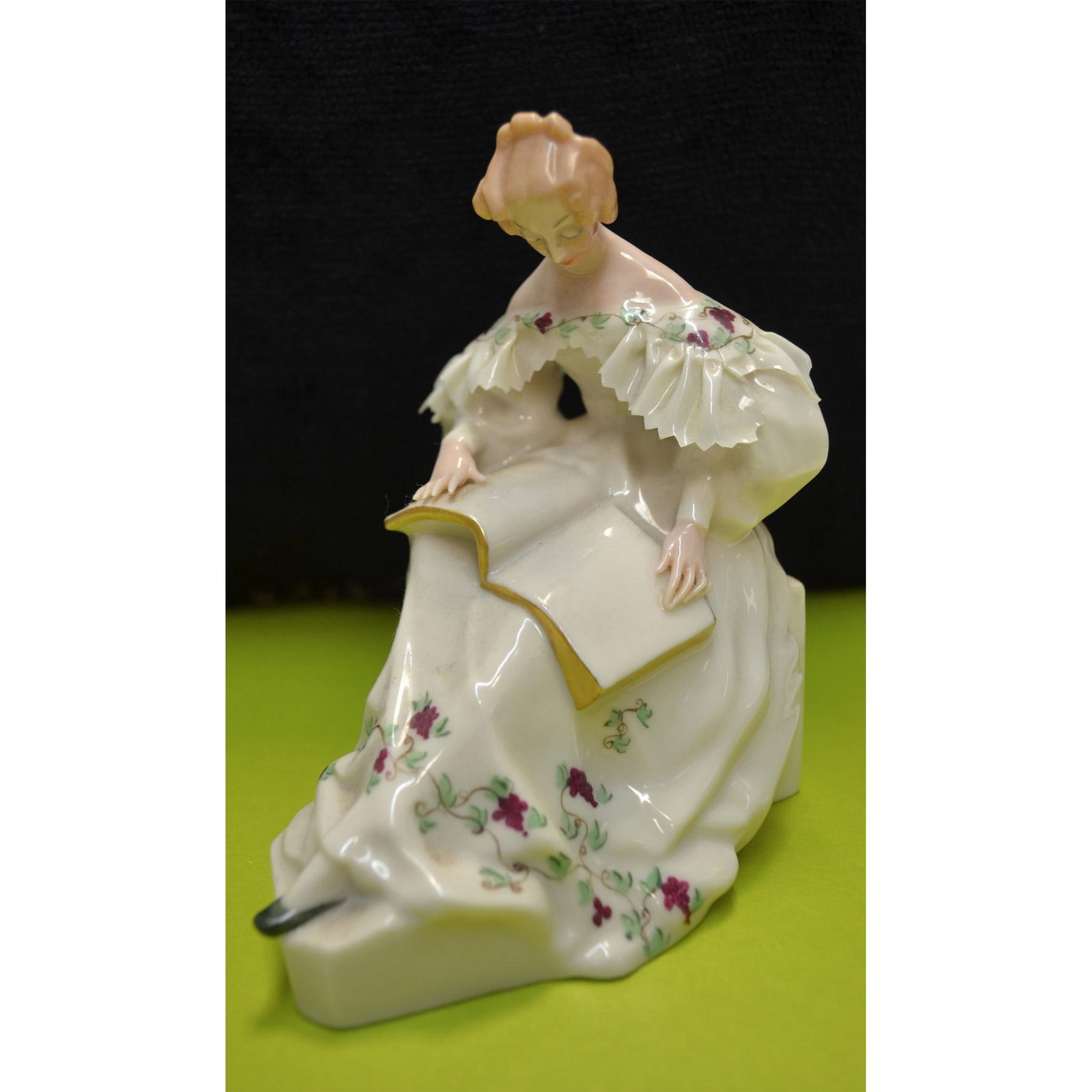 Lenox Porcelain Victorian Lady Figurine, Vintage, USA: Glazed Porcelain Decorated, hand created, hand painted by the Artists of the Lenox Porcelain Studios in the USA. Vintage and early, featuring a Lady seated, reading a book, elegantly dressed, in a dec