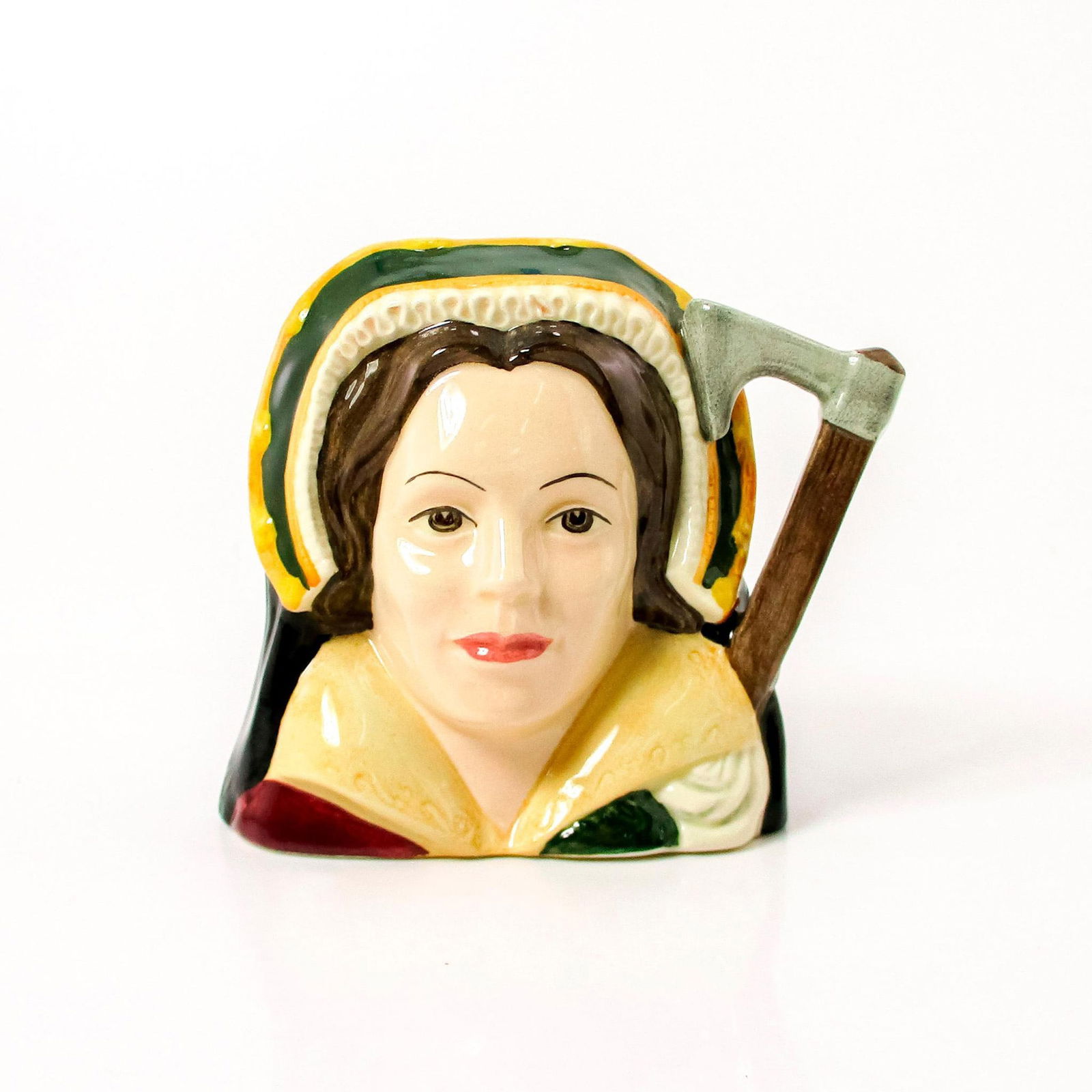 Catherine Howard D6692 - Small - Royal Doulton Character Jug: Brown, gold, and white coloration. Niece to the Duke of Norfolk, Catherine Howard (1521 - 1542) became Henry VIII's fifth wife on July 28, 1540, in a marriage arranged by her family. In 1541 Henry acc
