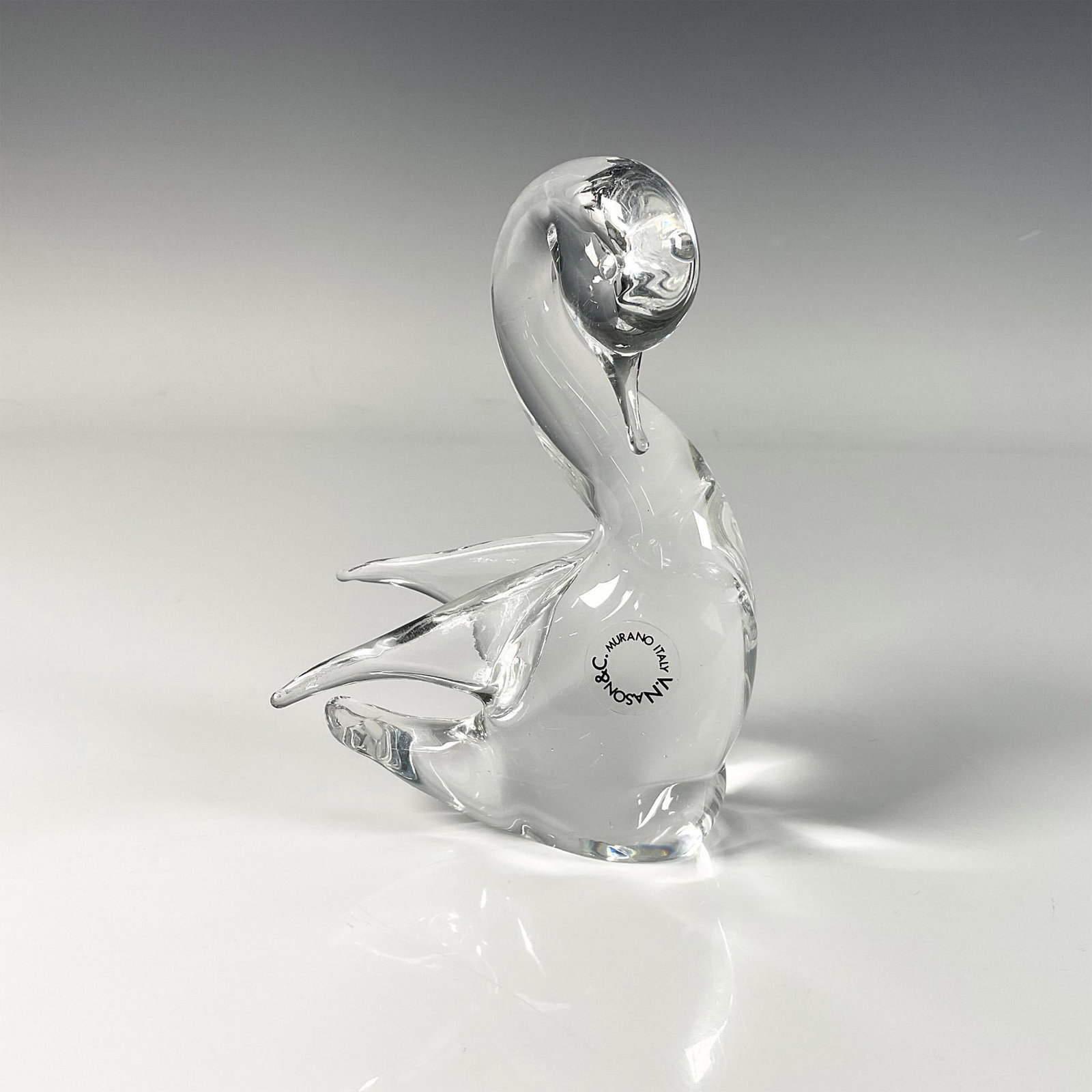 V. Nason & C Murano Italy Glass Figurine, Swan: Exquisite glass figure features elegantly crafted swans, V. Nason & C Murano Italy stickers on its body. Dimensions: 4.5"L x 3"W x 5.75"H Manufacturer: V. Nason & C Murano Country of Origin: Italy