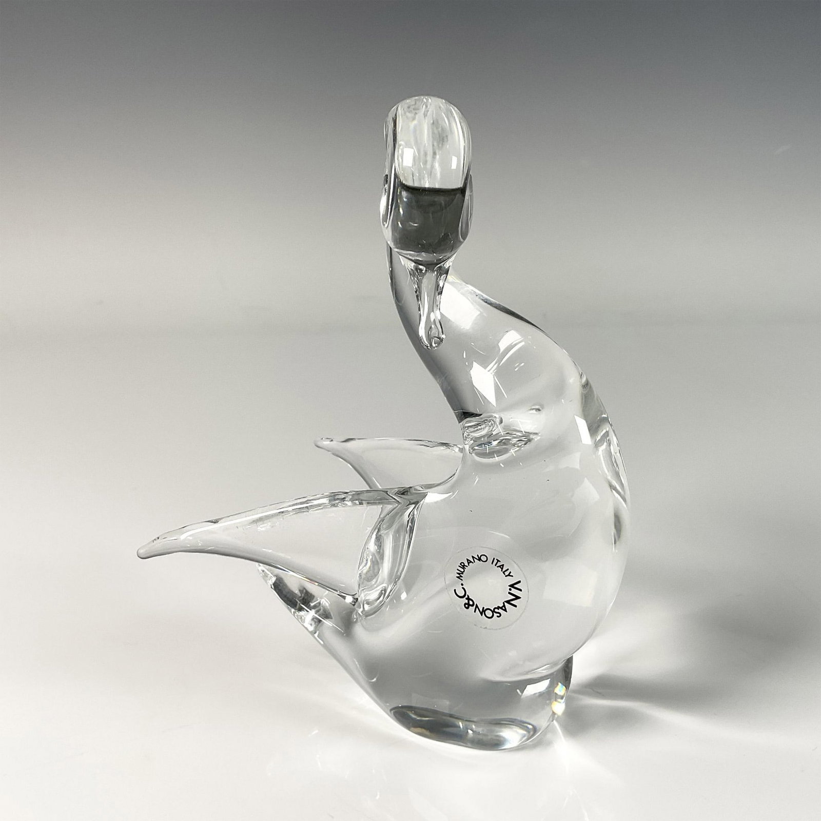 V. Nason & C Murano Italy Glass Figurine, Swan: Crafted from high quality Murano glass, the swan is elegantly posed, showing graceful curves and delicate detailing. V. Nason & C Murano Italy stickers on its body. Dimensions: 4.5"L x 3"W x 5.75"H Ma