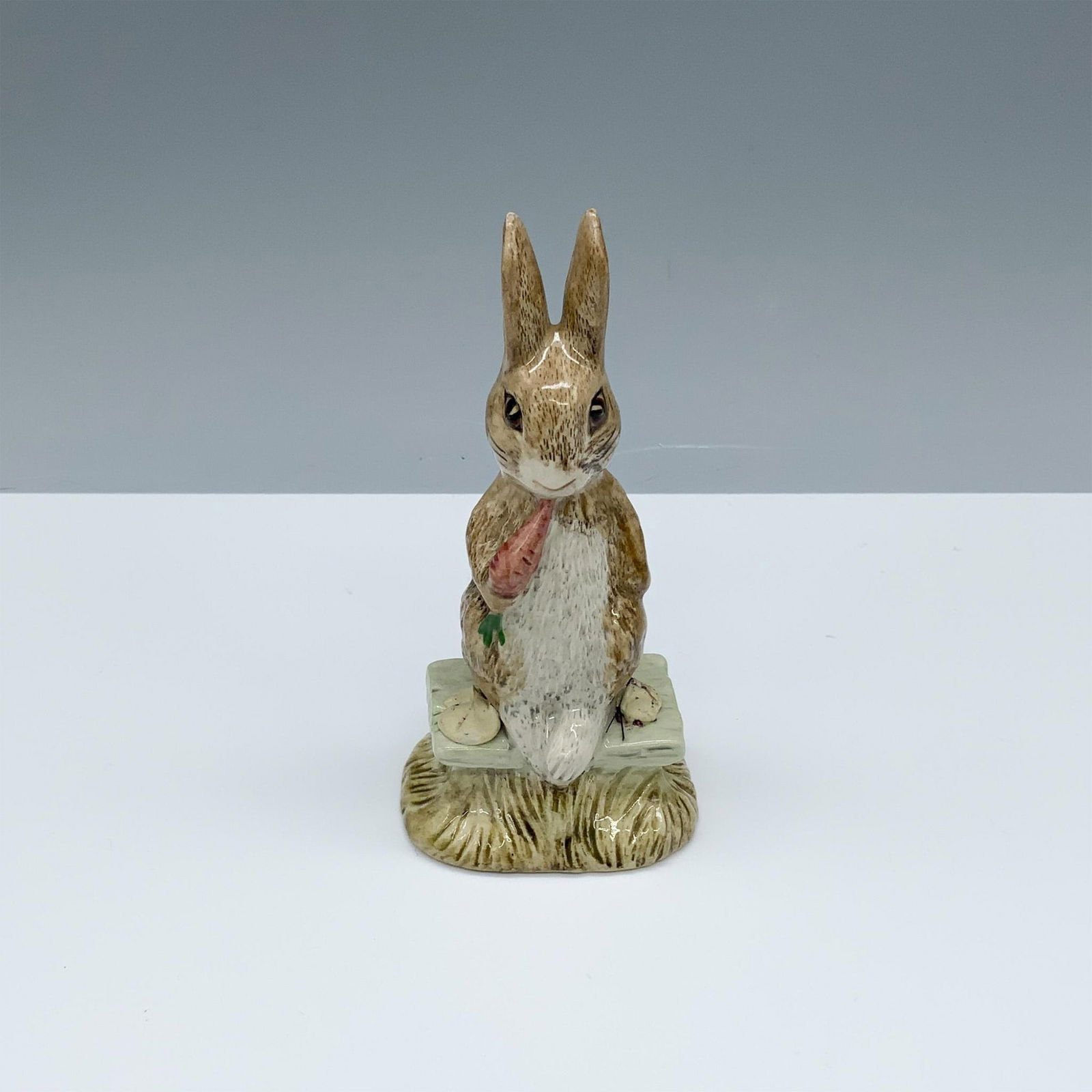 Fierce Bad Rabbit - Royal Albert - Beatrix Potter Figurine: Glossy porcelain figure of a bunny sitting with a carrot in their mouth. Royal Albert Beatrix Potter backstamp. This item has its original box (2.5"L x 2"W x 5"H). Issued: c. 1989 Dimensions: 2.25"L x