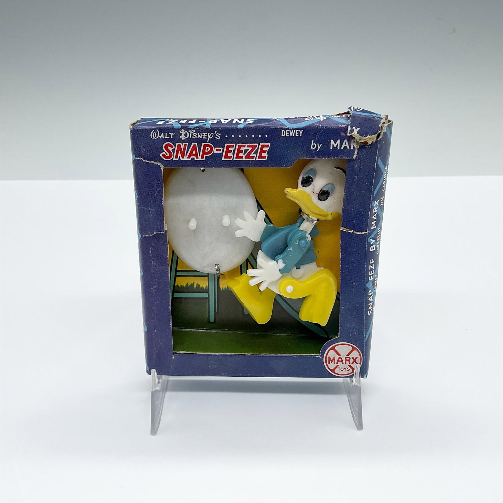 Vintage Marx Toys Disney Snap-Eeze Figurine, Dewey: Walt Disney painted figure with its own stand. The toy is to stand in several funny poses. Figure is hand painted and placed in original Marx Snap-Eeze box. Issued: Mid 20th Century Dimensions: 3.5"L 