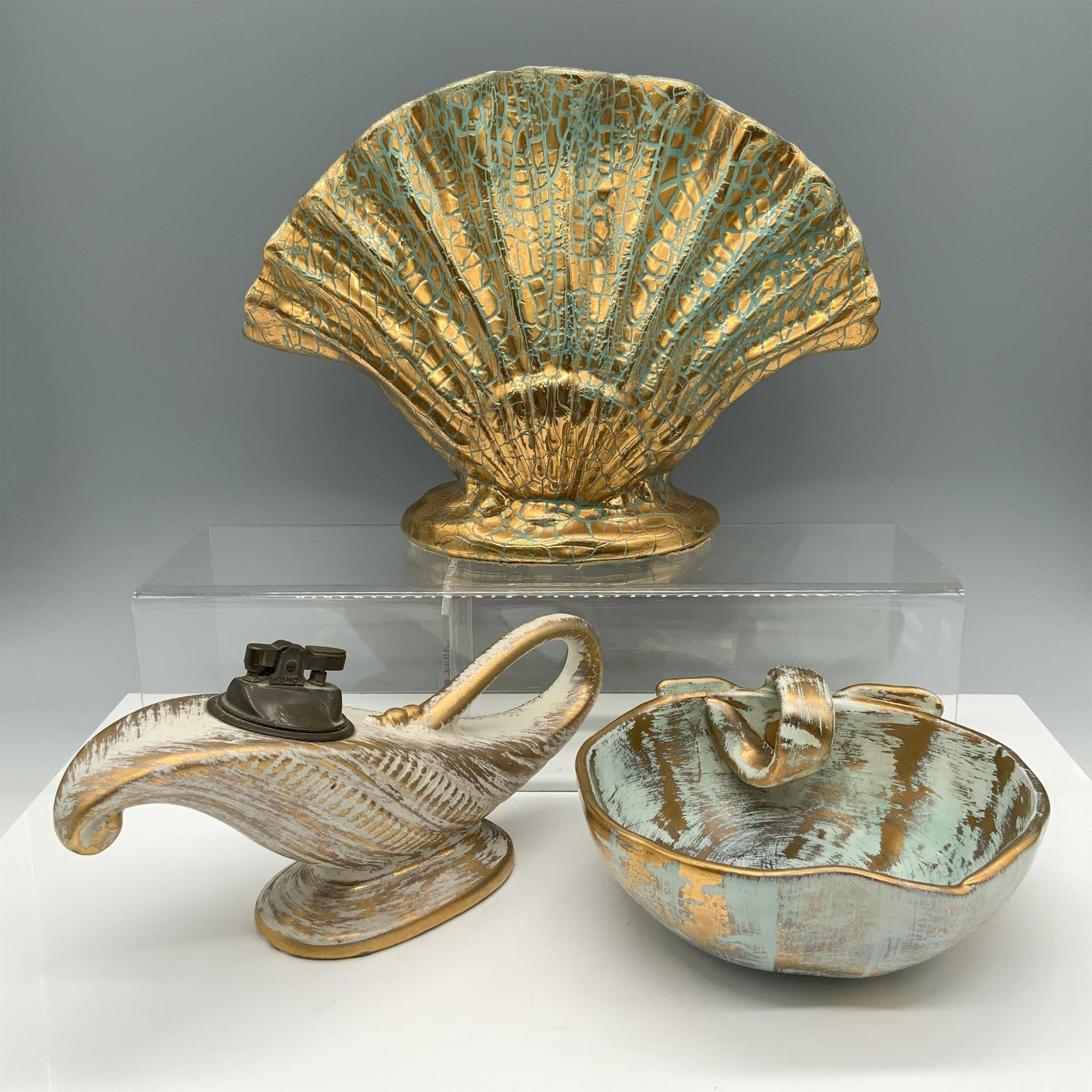 3pc Gonder, Stangl, & Royal Haeger Iridescent Home Decor: Fabulous collection of gold toned decor that consists of a shell fan vase with a Gonder USA backstamp, a hand painted apple shaped bowl with a Stangl backstamp, and a tabletop lighter shaped like a ge